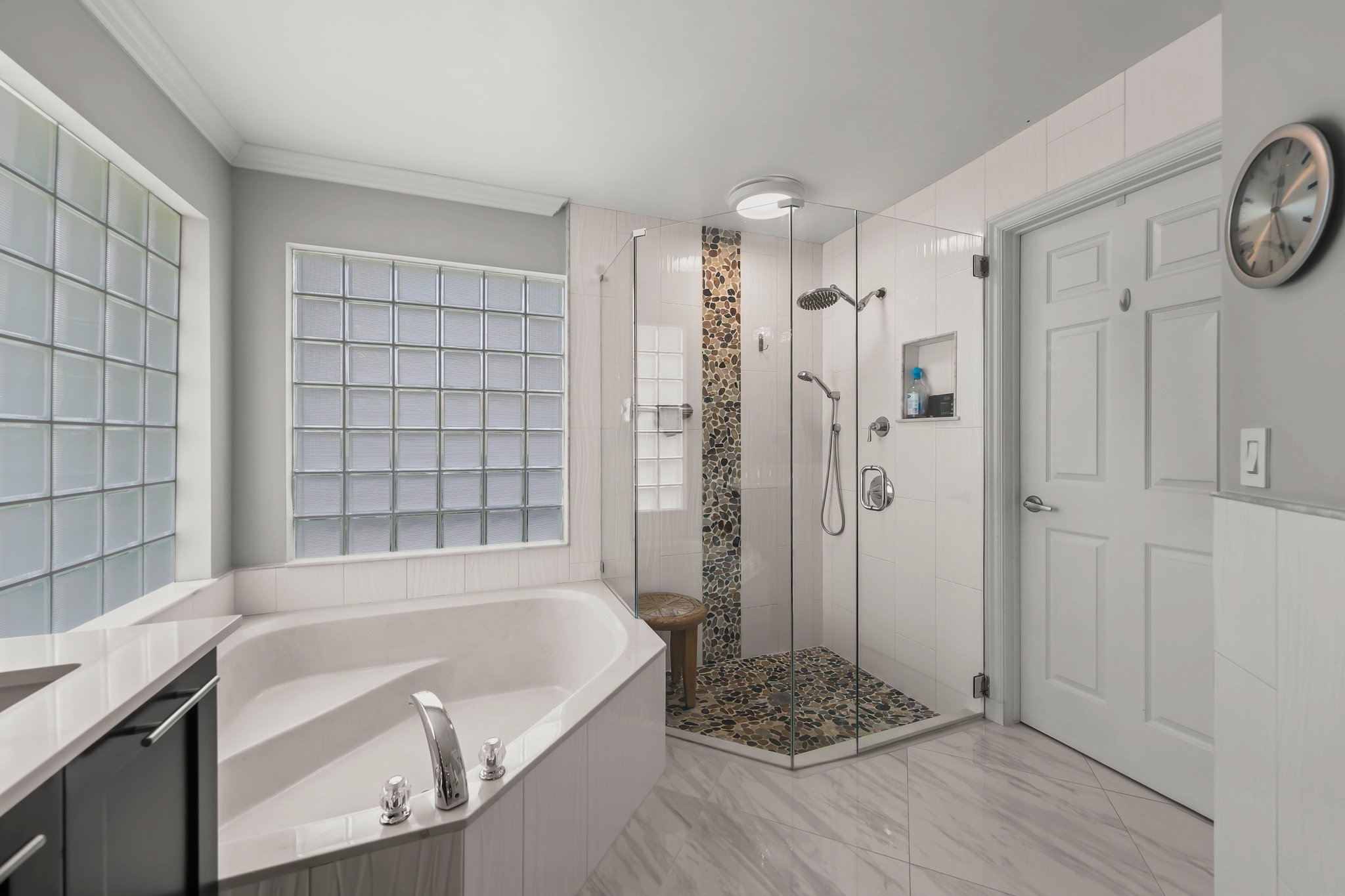 20317 Hacienda Court Boca Raton, FL 33498 - Photo 34 of 100 a bathroom with a bathtub a toilet and a shower