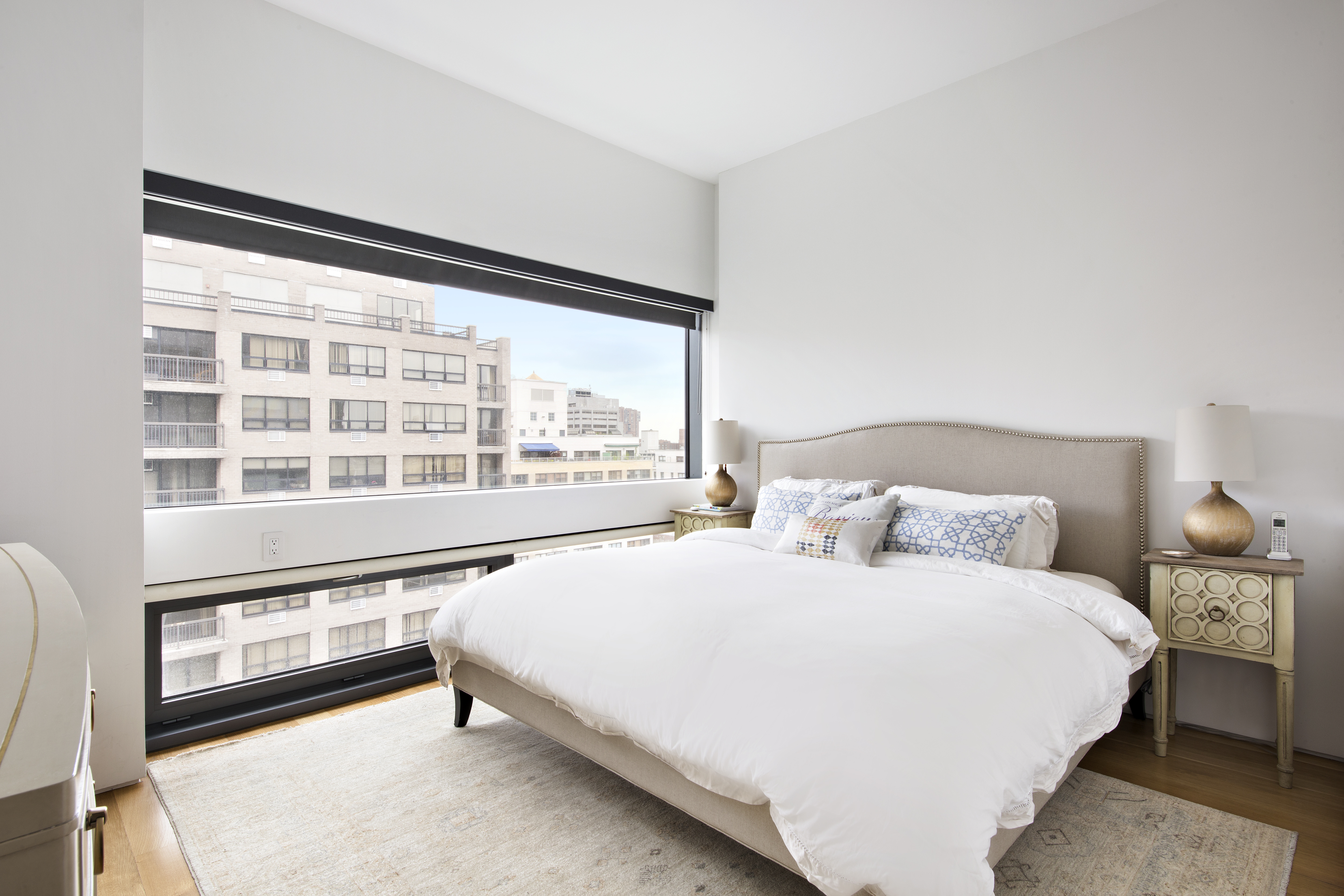 123 3rd Avenue, Unit 11A Manhattan, NY 10003 - Photo 5 of 11 a bedroom with a bed and a large window