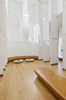 a picture of a room with lots of white walls and black white appliances