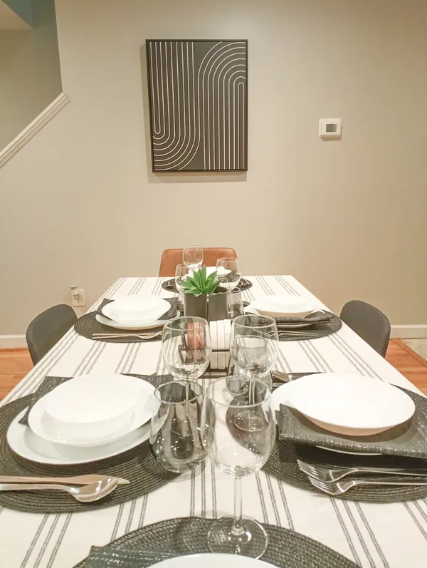 a dining room with table and chairs