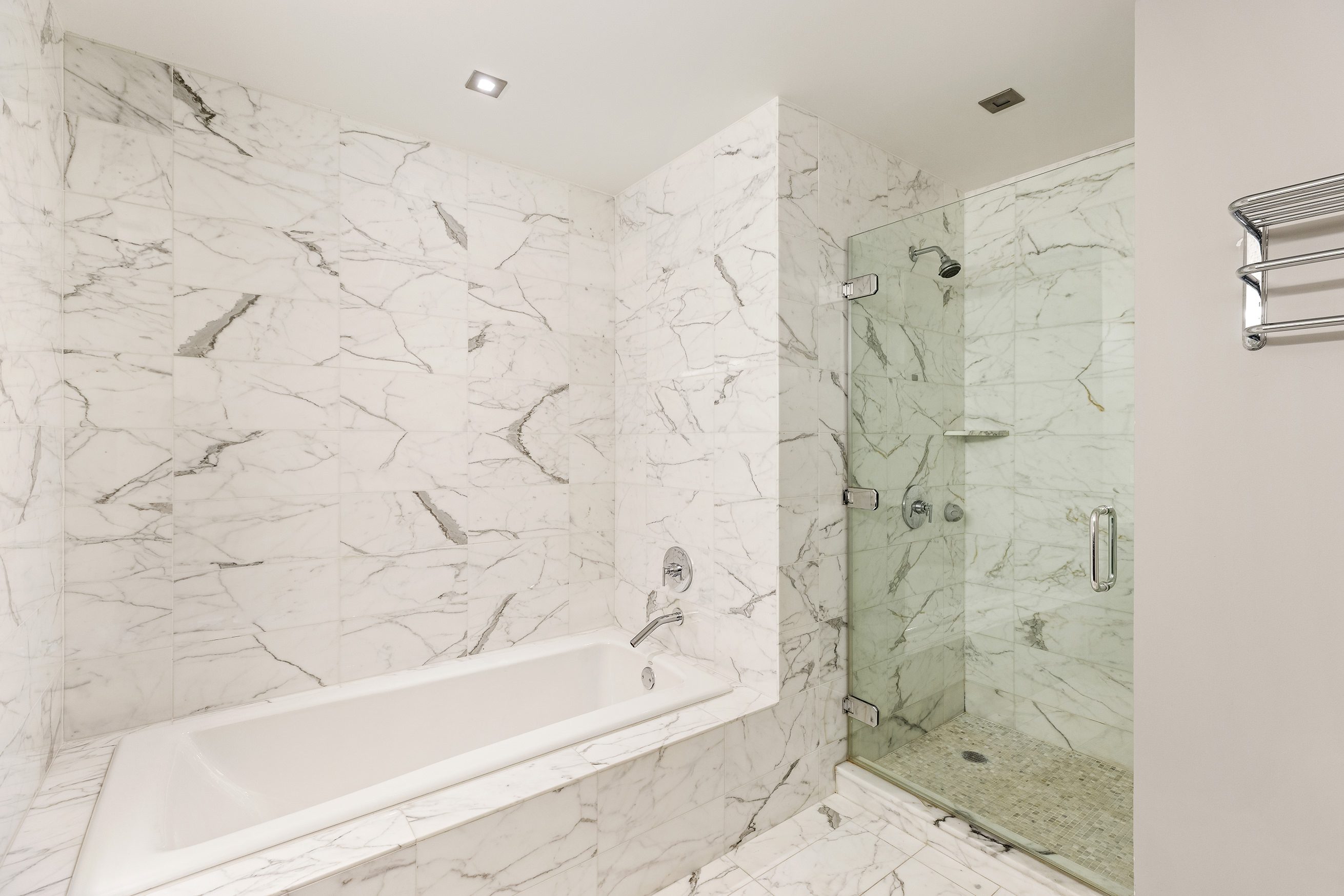 46-30 Center Boulevard, Unit 610 Queens, NY 11109 - Photo 5 of 19 a bathroom with a bathtub and shower
