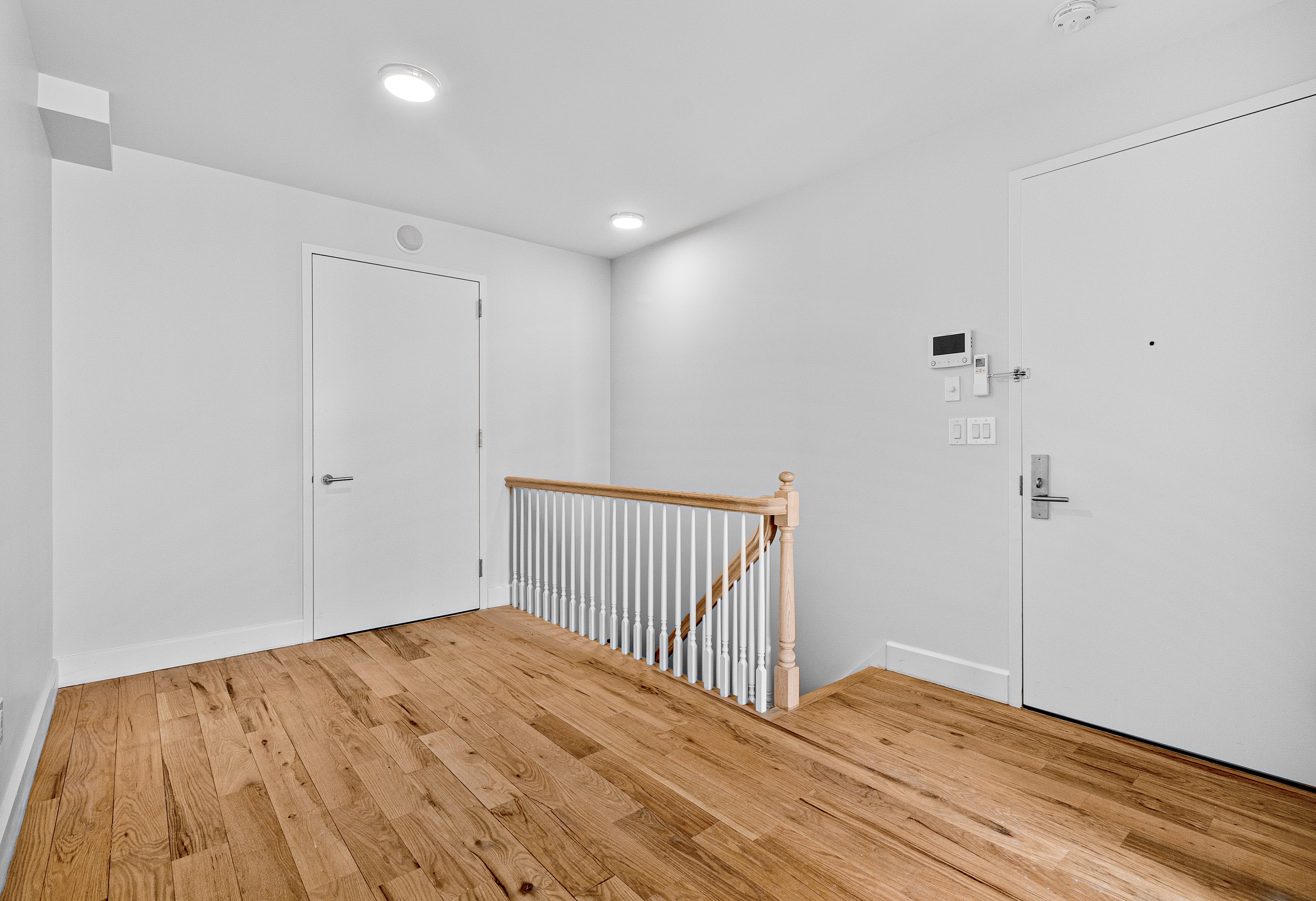 1098 Madison Street, Unit 1A Brooklyn, NY 11221 - Photo 6 of 15 a view of a room with wooden floor