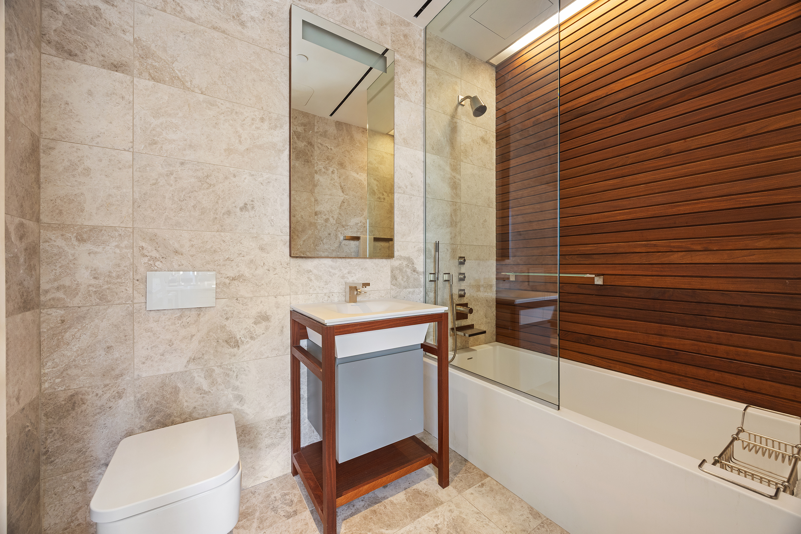 1 Great Jones Alley, Unit 10 Manhattan, NY 10012 - Photo 27 of 41 a bathroom with a sink a toilet and shower
