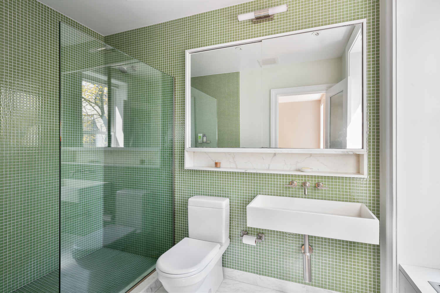 380 3rd Street, Unit PARLOR Brooklyn, NY 11215 - Photo 12 of 19 a bathroom with a sink a toilet and mirror