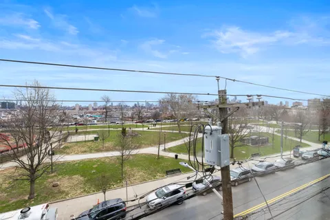 a view of swimming pool from a balcony