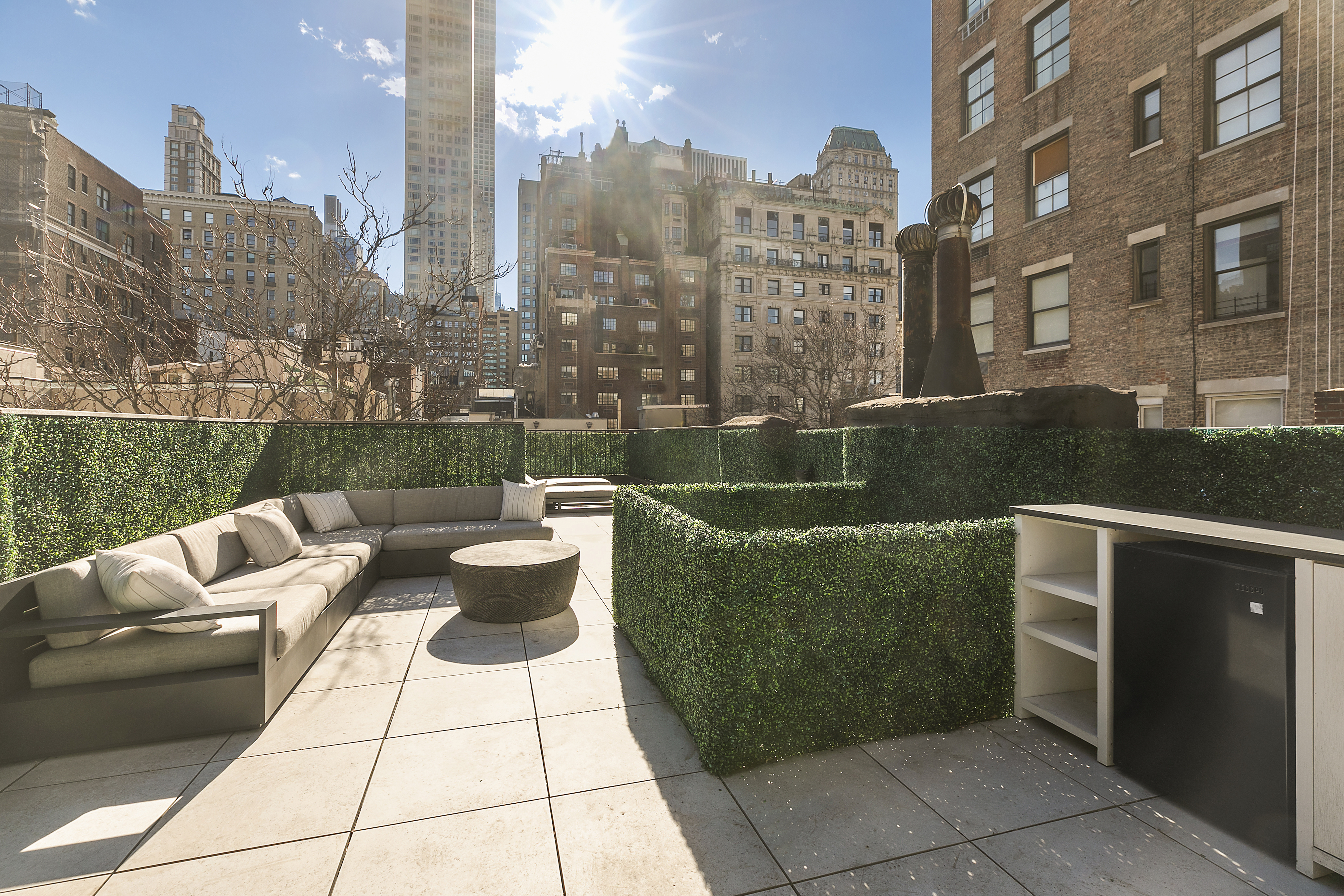 36 East 64th Street Manhattan, NY 10065 - Photo 23 of 27 a view of a patio with couches and a fire pit and a fire pit