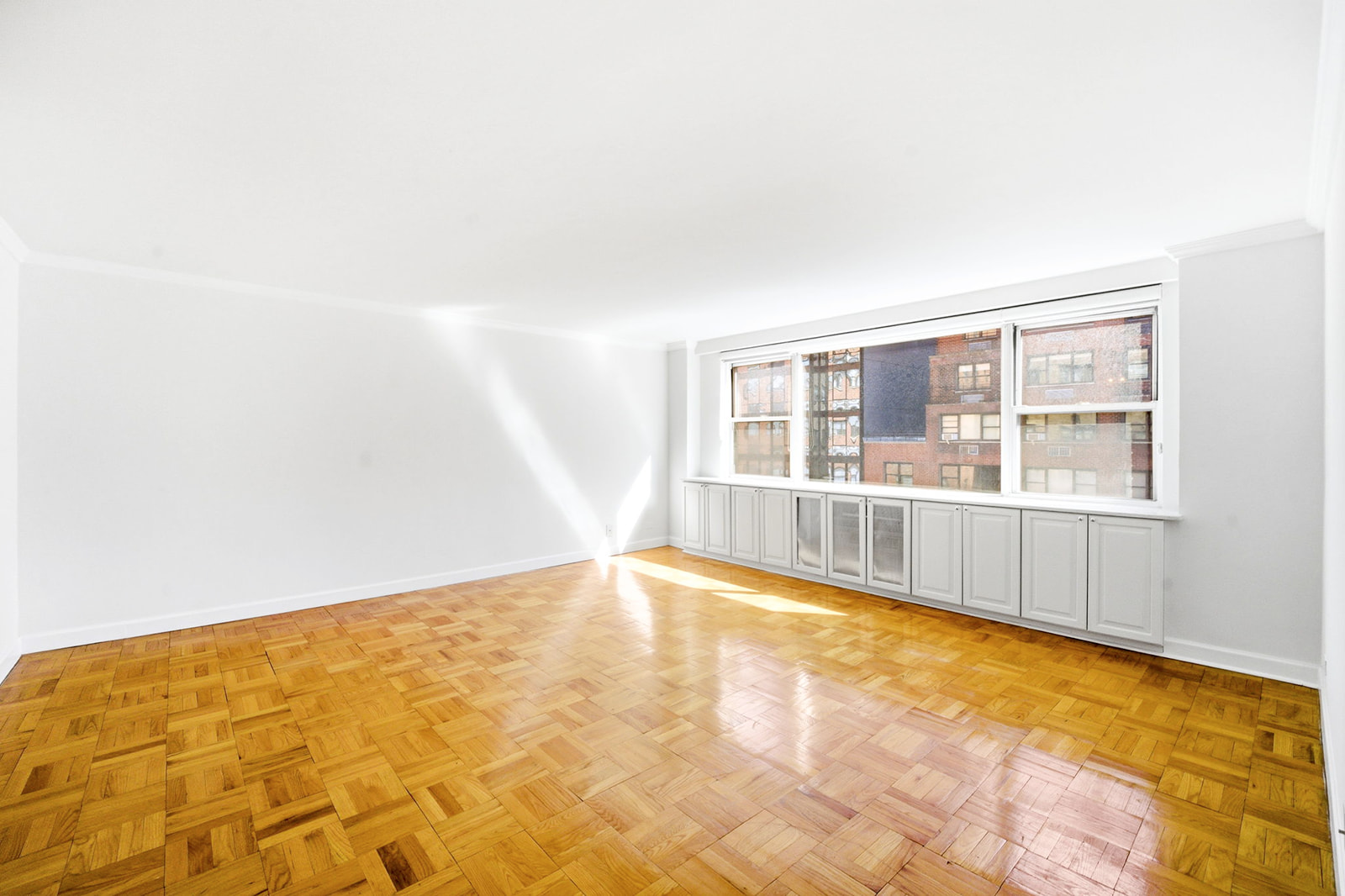 139 East 33rd Street, Unit 12DE Manhattan, NY 10016 - Photo 10 of 27 a view of an empty room with a window