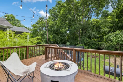 a view of a chair and table in the balcony