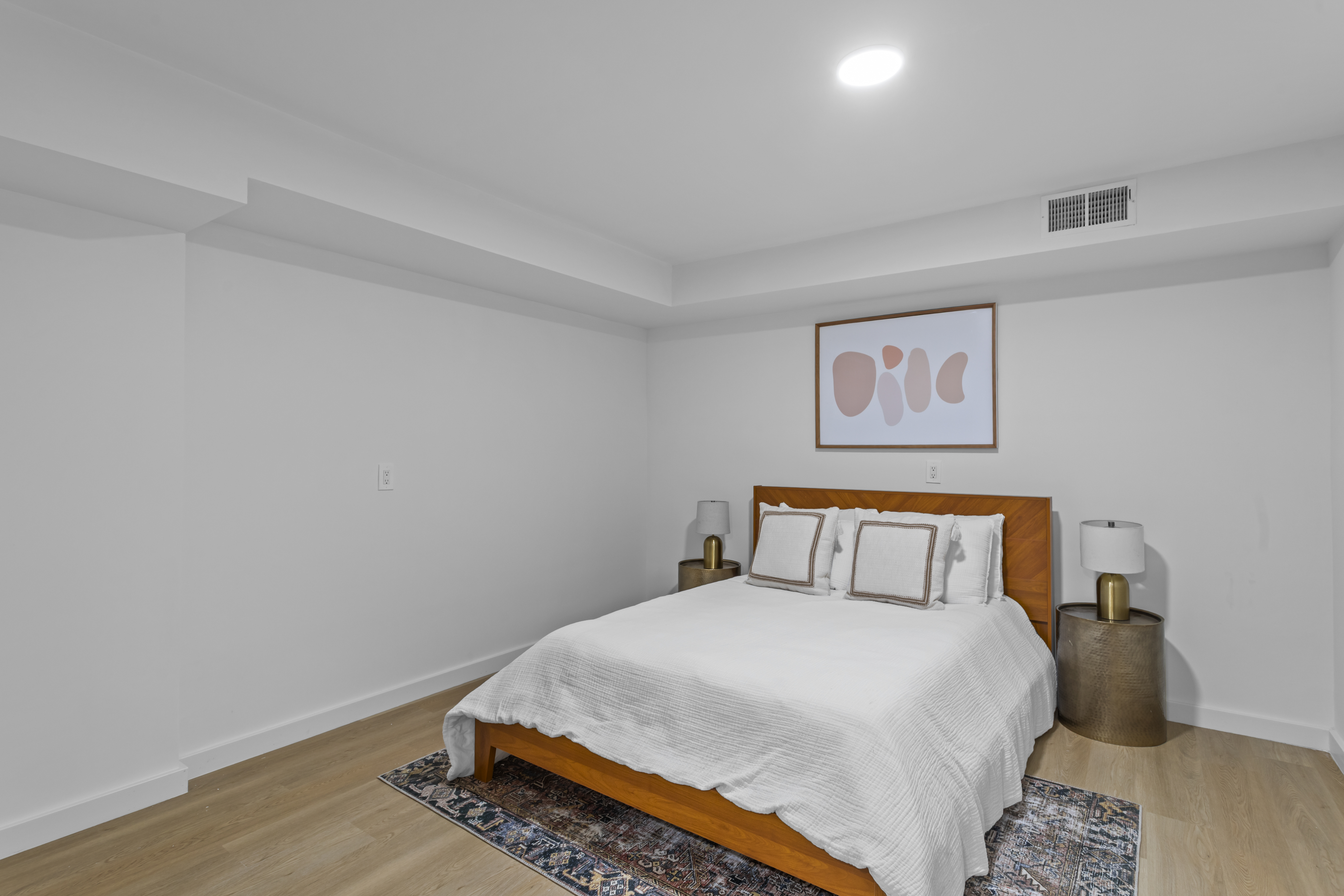 3112 Emmons Avenue, Unit 3124A2 Brooklyn, NY 11235 - Photo 11 of 17 a bedroom with a bed and wooden floor