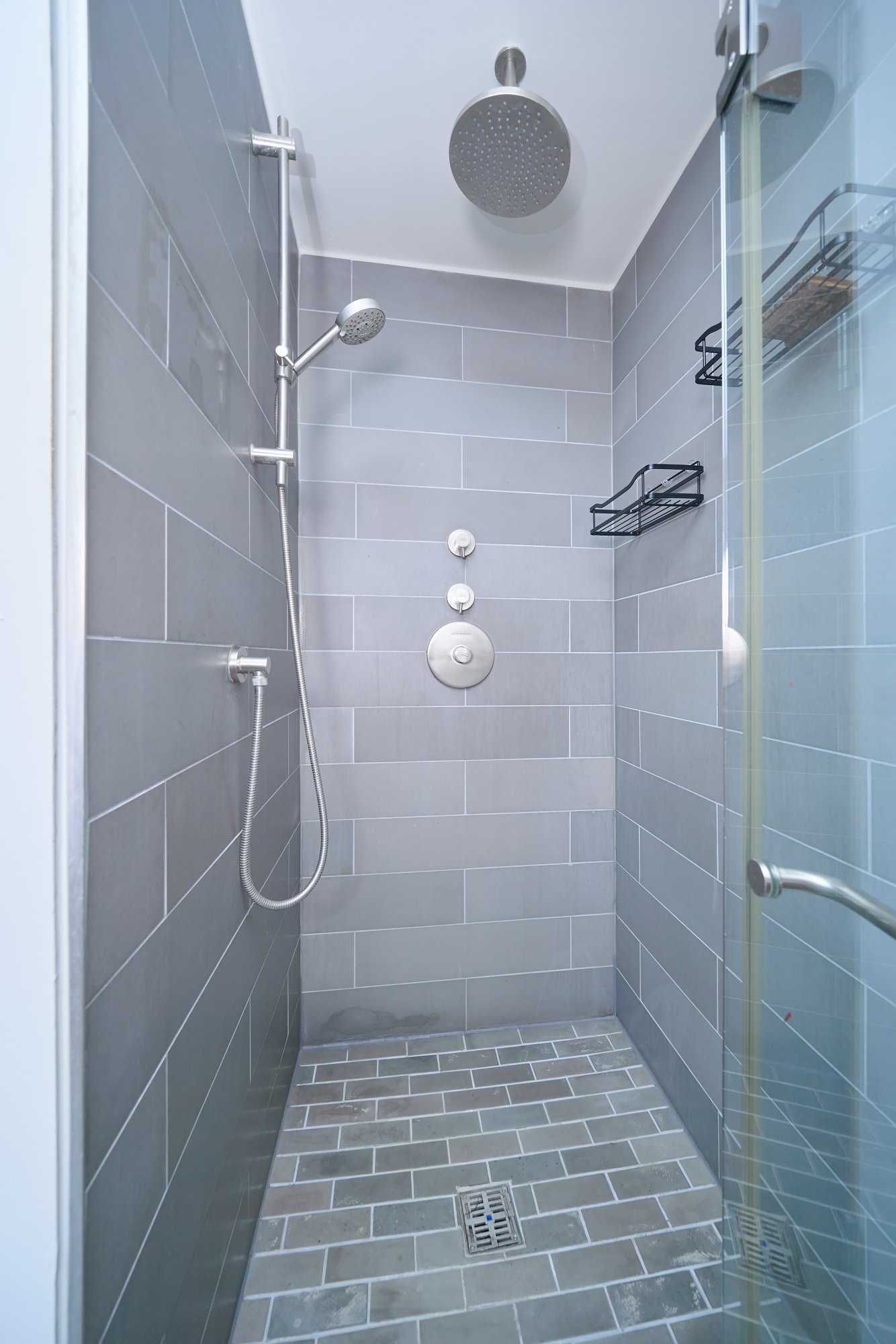 2280 Frederick Douglass Boulevard, Unit 5D Manhattan, NY 10027 - Photo 16 of 22 a bathroom with a glass door shower