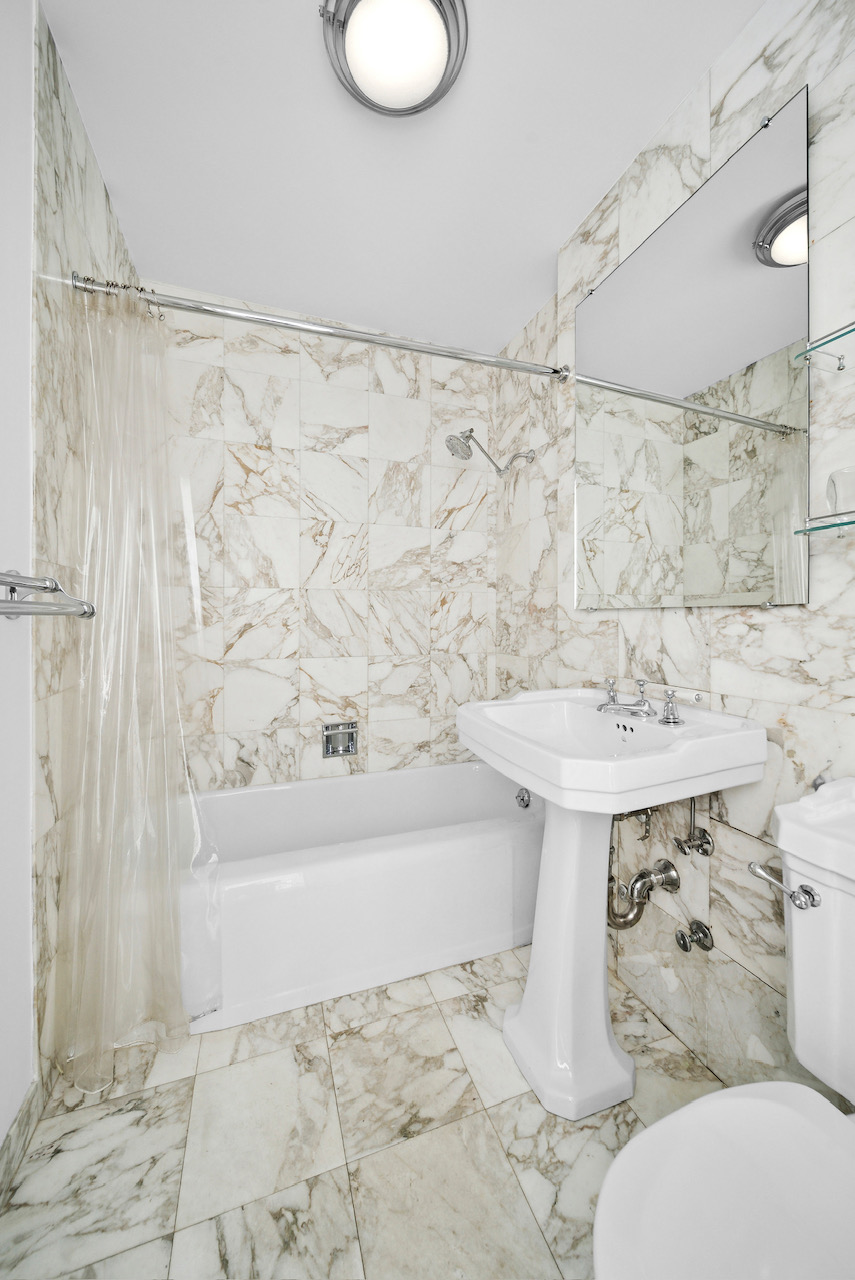 12 Beekman Place, Unit PHA Manhattan, NY 10022 - Photo 11 of 12 a bathroom with a sink toilet and shower