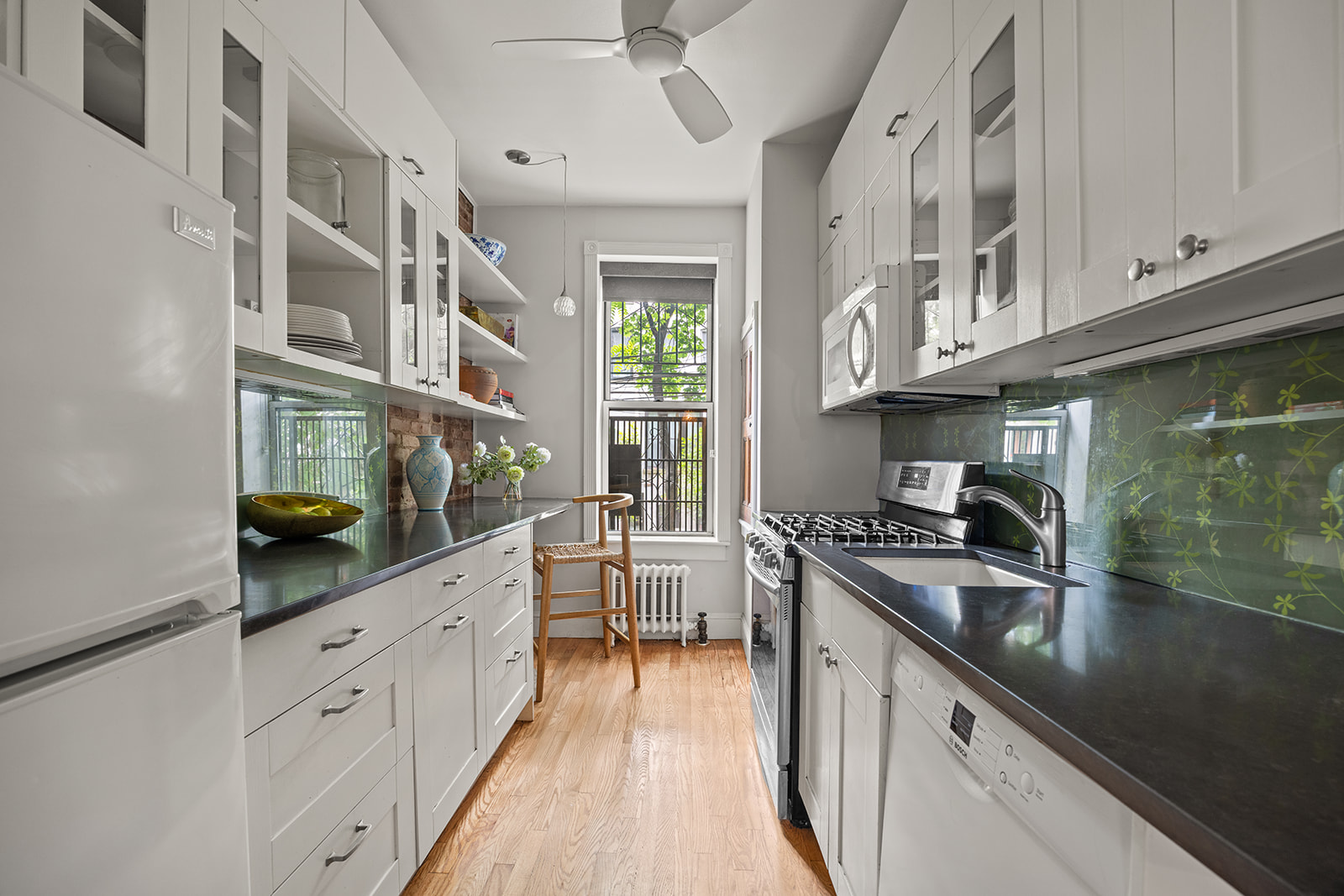 162 Garfield Place, Unit 1L Brooklyn, NY 11215 - Photo 5 of 13 a kitchen with stainless steel appliances granite countertop a stove and cabinets