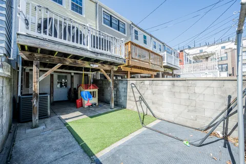a view of a chairs and table in a balcony