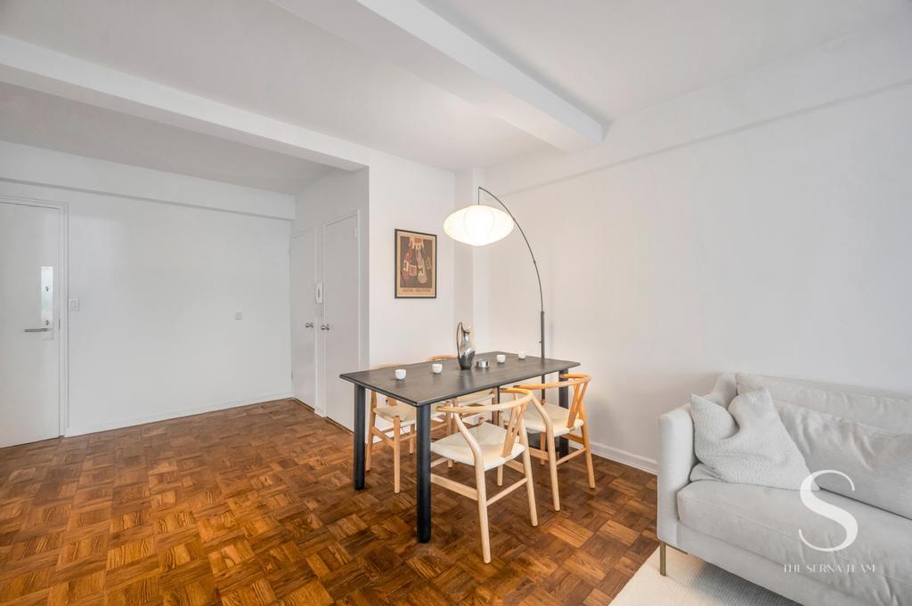 7 Lexington Avenue, Unit 5E Manhattan, NY 10010 - Photo 9 of 27 a view of a livingroom with furniture and wooden floor