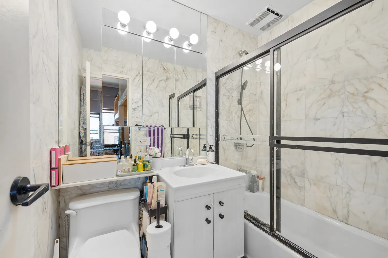 a bathroom with a sink double vanity and a mirror