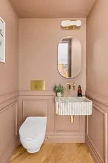 a bathroom with a sink mirror and vanity