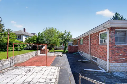 a view of house with patio outdoor seating