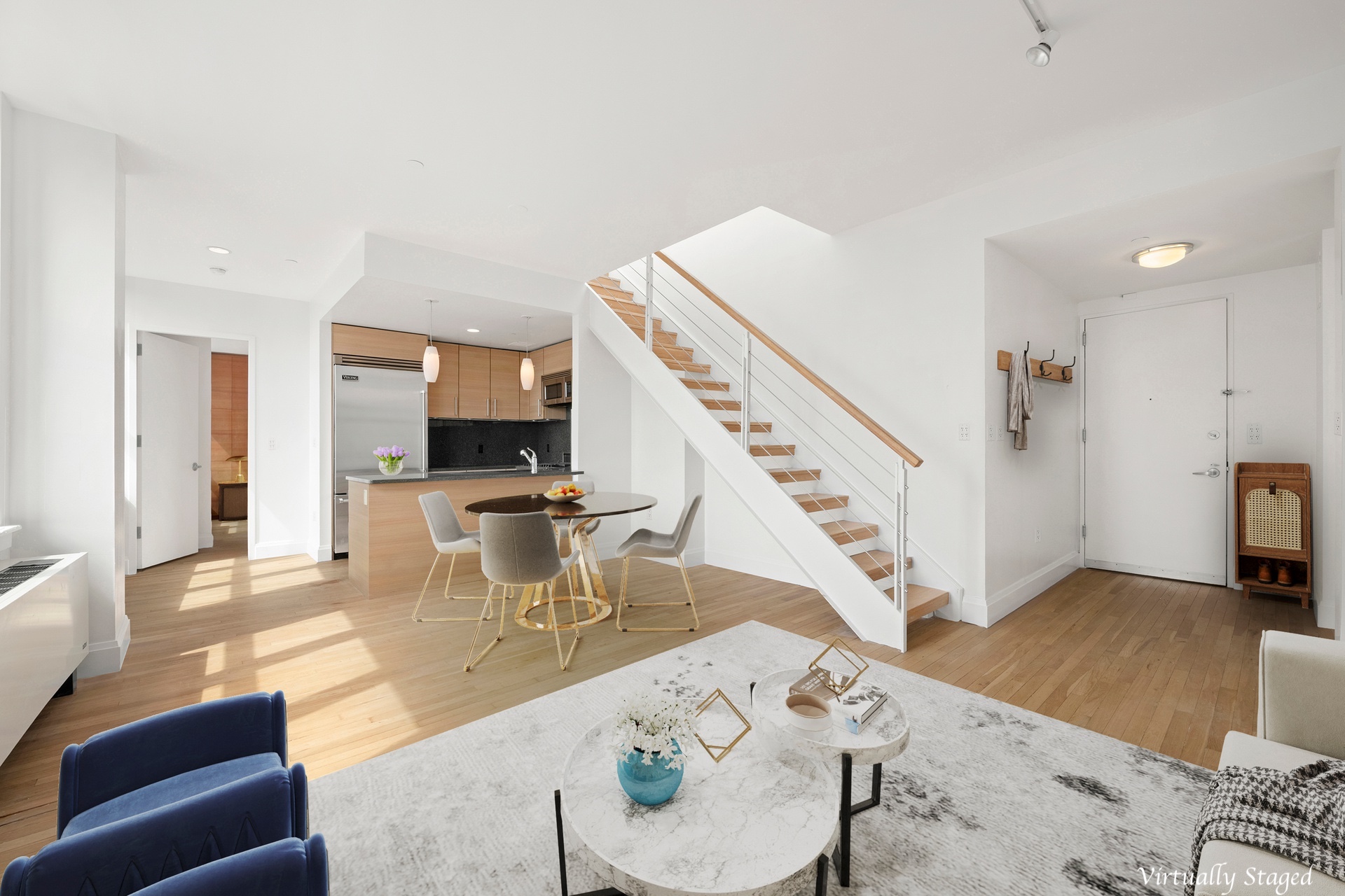 199 State Street, Unit PHD Brooklyn, NY 11201 - Photo 2 of 11 a living room with furniture and wooden floor
