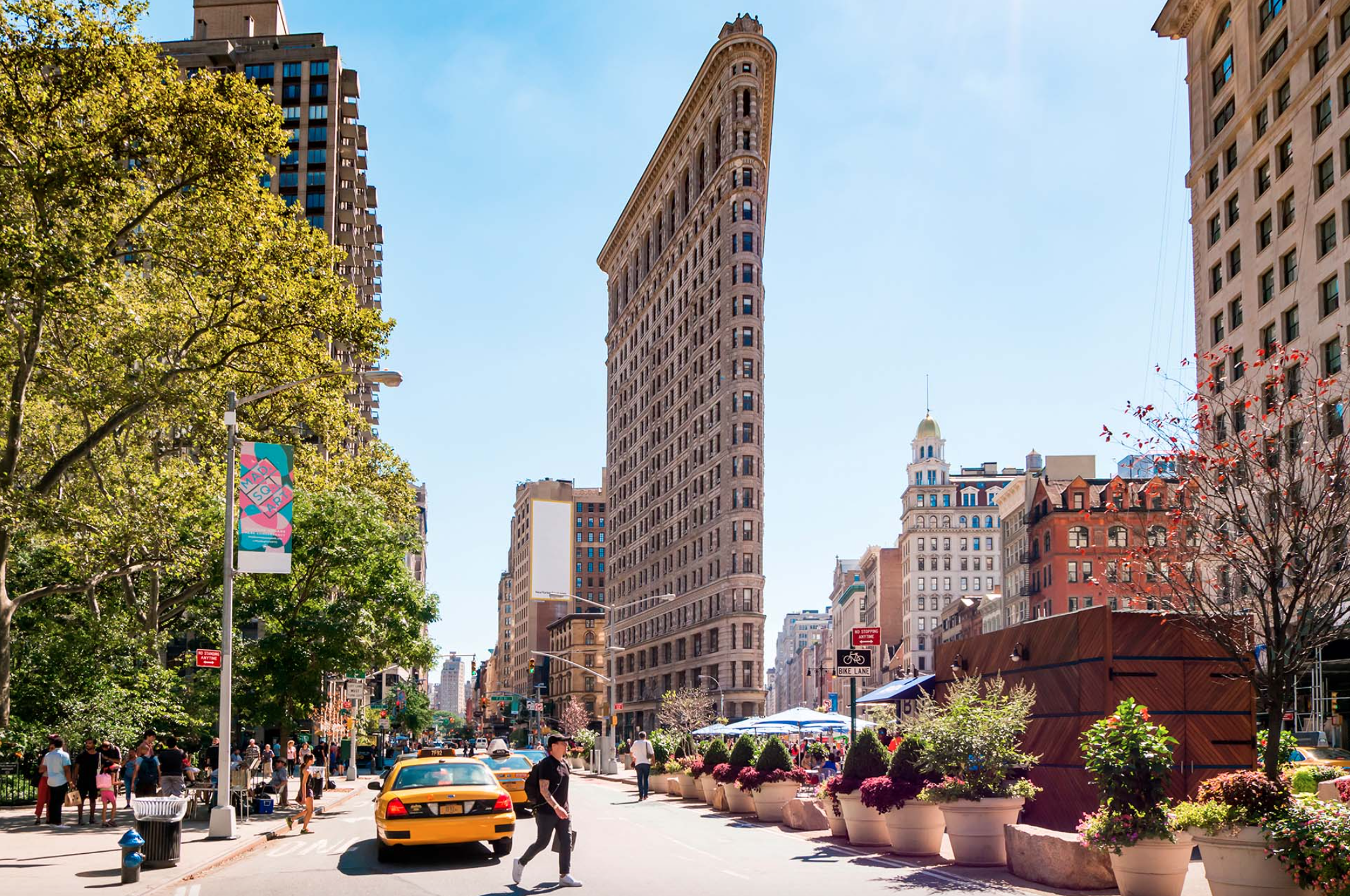 129 West 20th Street, Unit 5C Manhattan, NY 10011 - Photo 11 of 12 a city street filled with lots of tall buildings and cars