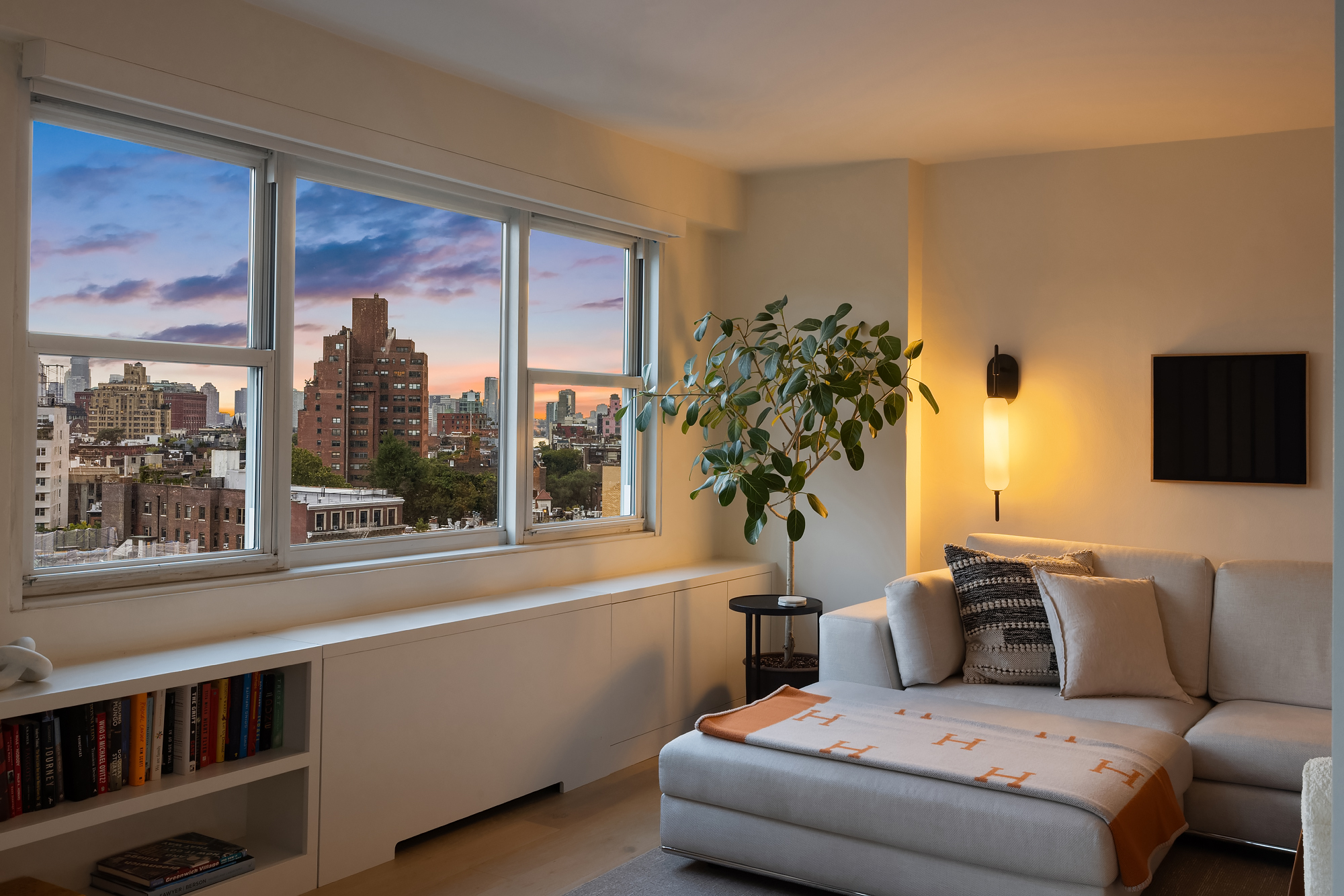 101 West 12th Street, Unit 12R Manhattan, NY 10011 - Photo 6 of 21 a living room with furniture and a large window