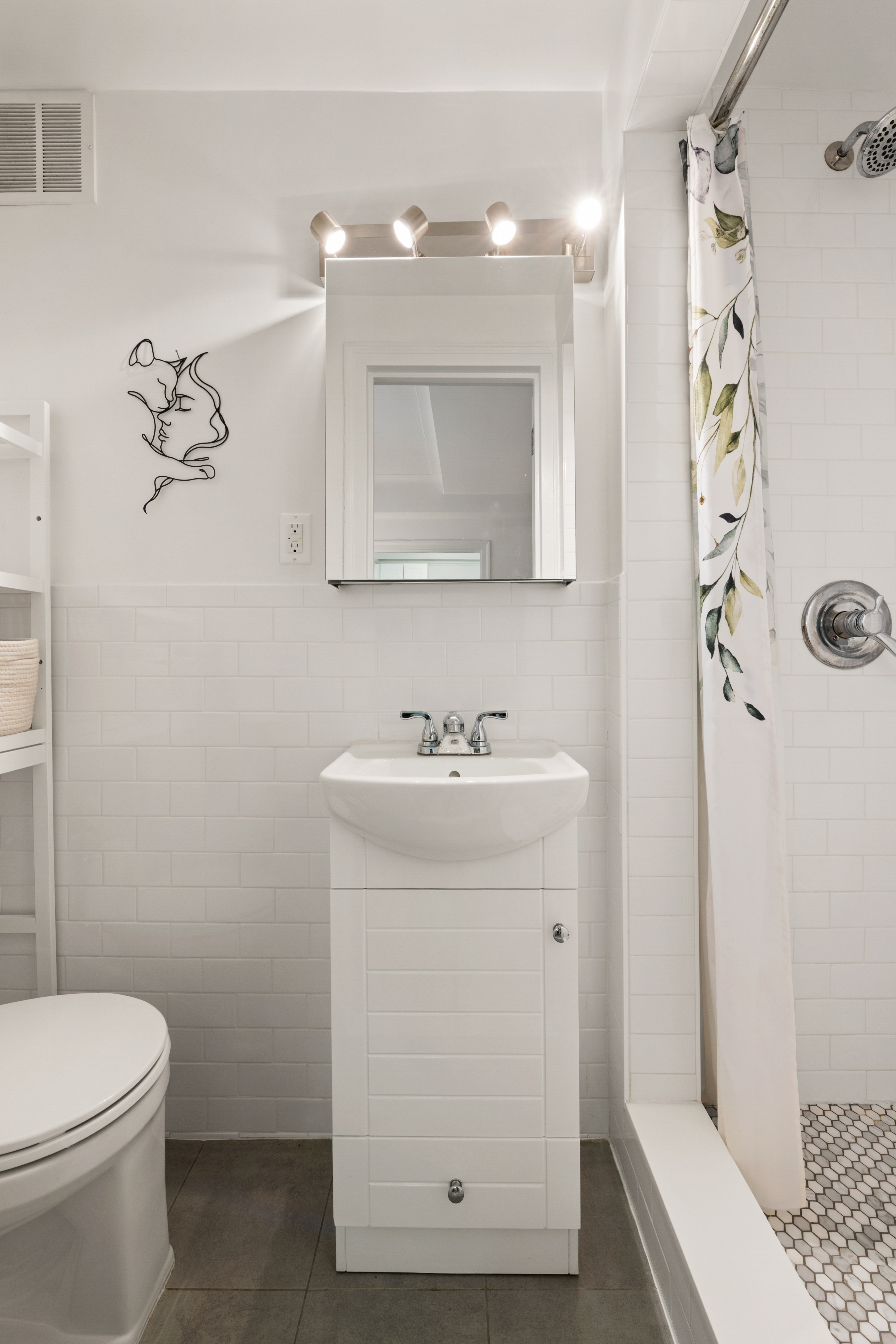 33 Riverside Drive, Unit 4D Manhattan, NY 10023 - Photo 5 of 9 a bathroom with a sink a toilet and shower