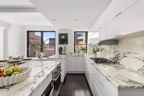 a kitchen with a sink stove and window