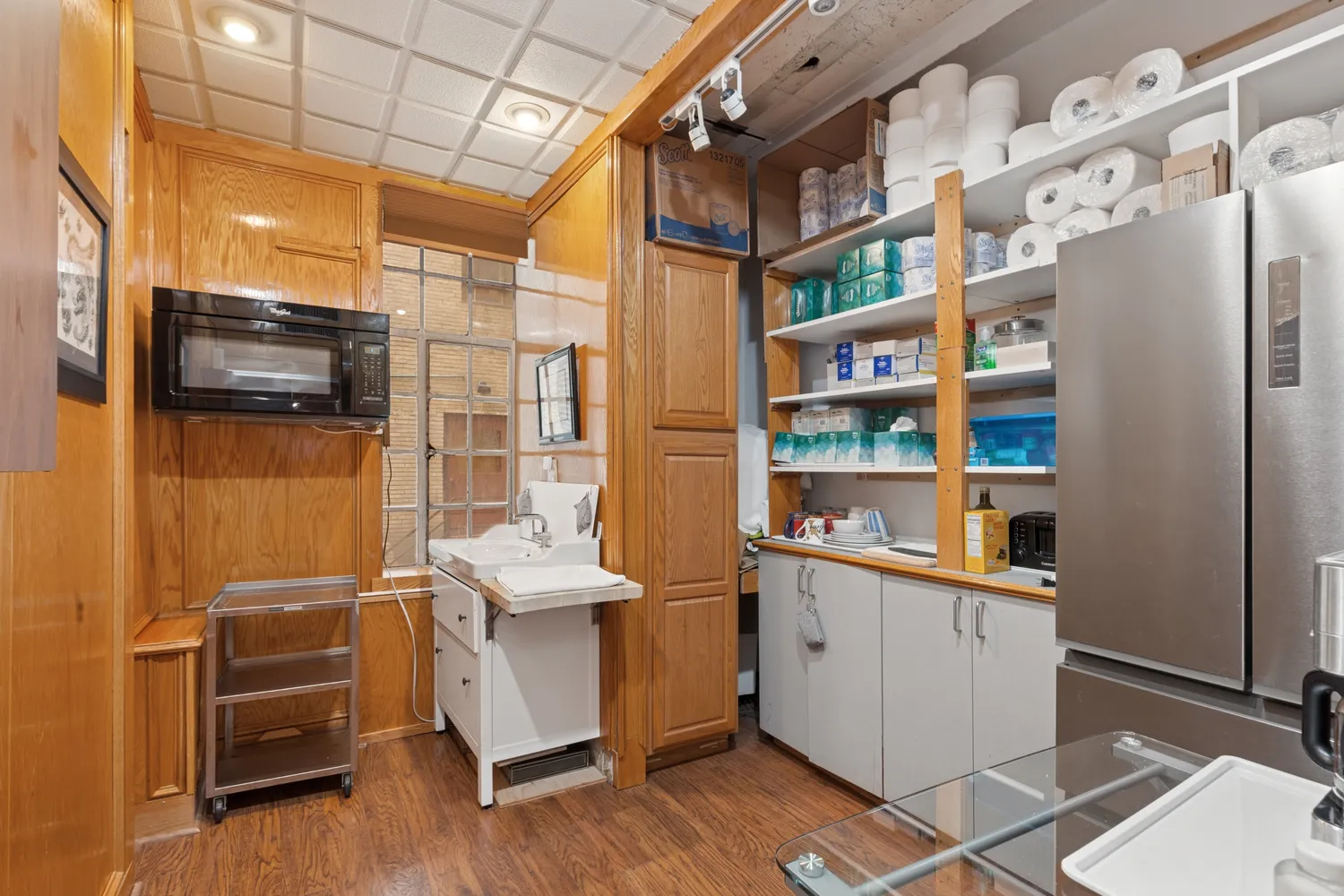 a room with furniture a flat screen tv and a window