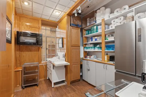 a room with furniture a flat screen tv and a window