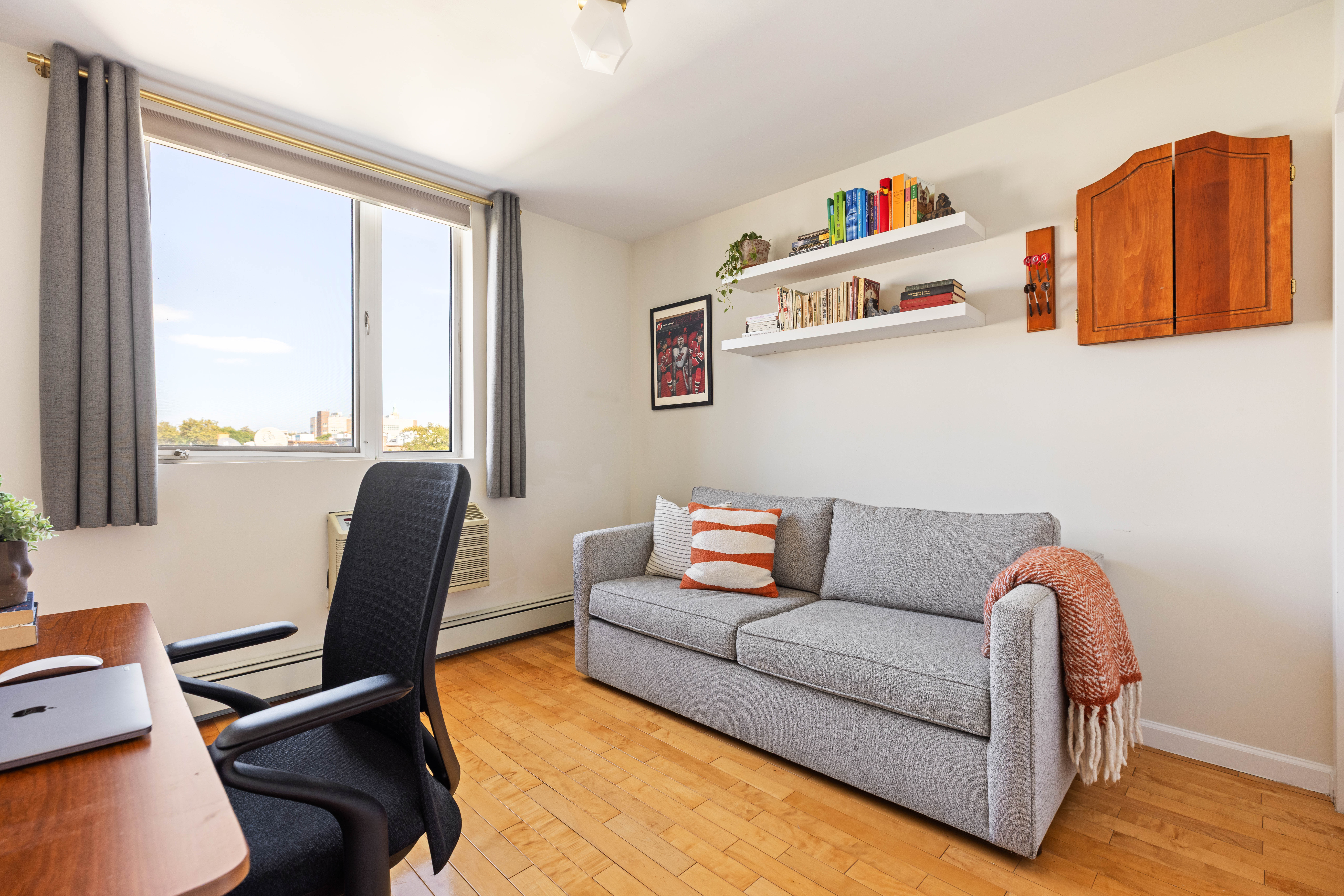 93-95 Wyckoff Avenue, Unit 4B Brooklyn, NY 11237 - Photo 7 of 10 a living room with furniture and a window