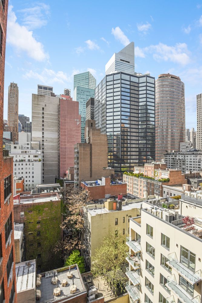 251 East 51st Street, Unit 6K Manhattan, NY 10022 - Photo 15 of 16 a view of a city with tall buildings