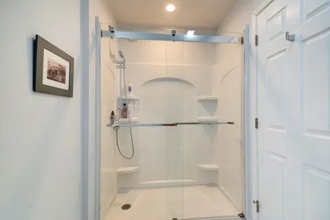 a white toilet sitting next to a bathroom sink