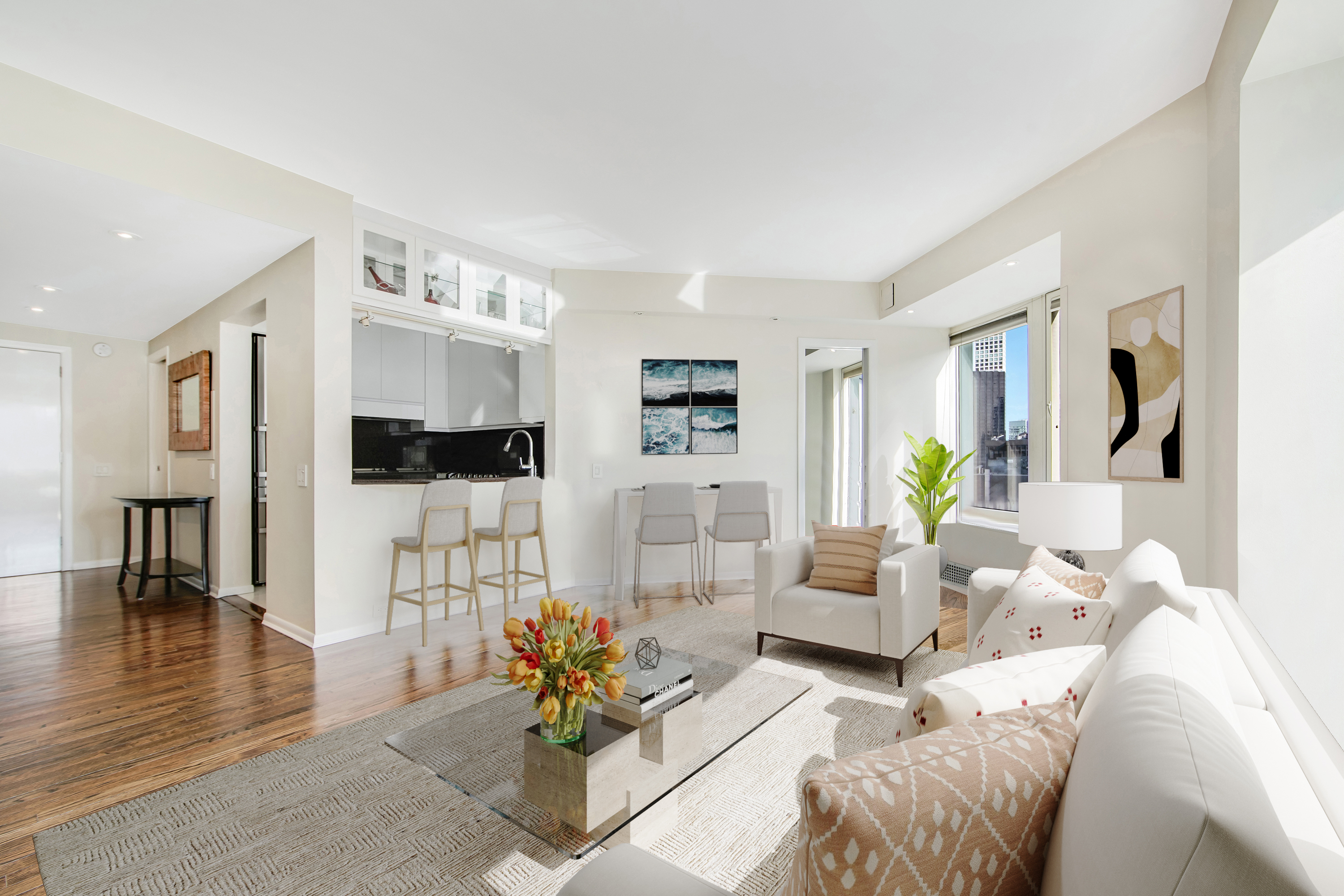 150 West 56th Street, Unit 3812 Manhattan, NY 10019 - Photo 2 of 14 a living room with furniture and a dining area with kitchen view