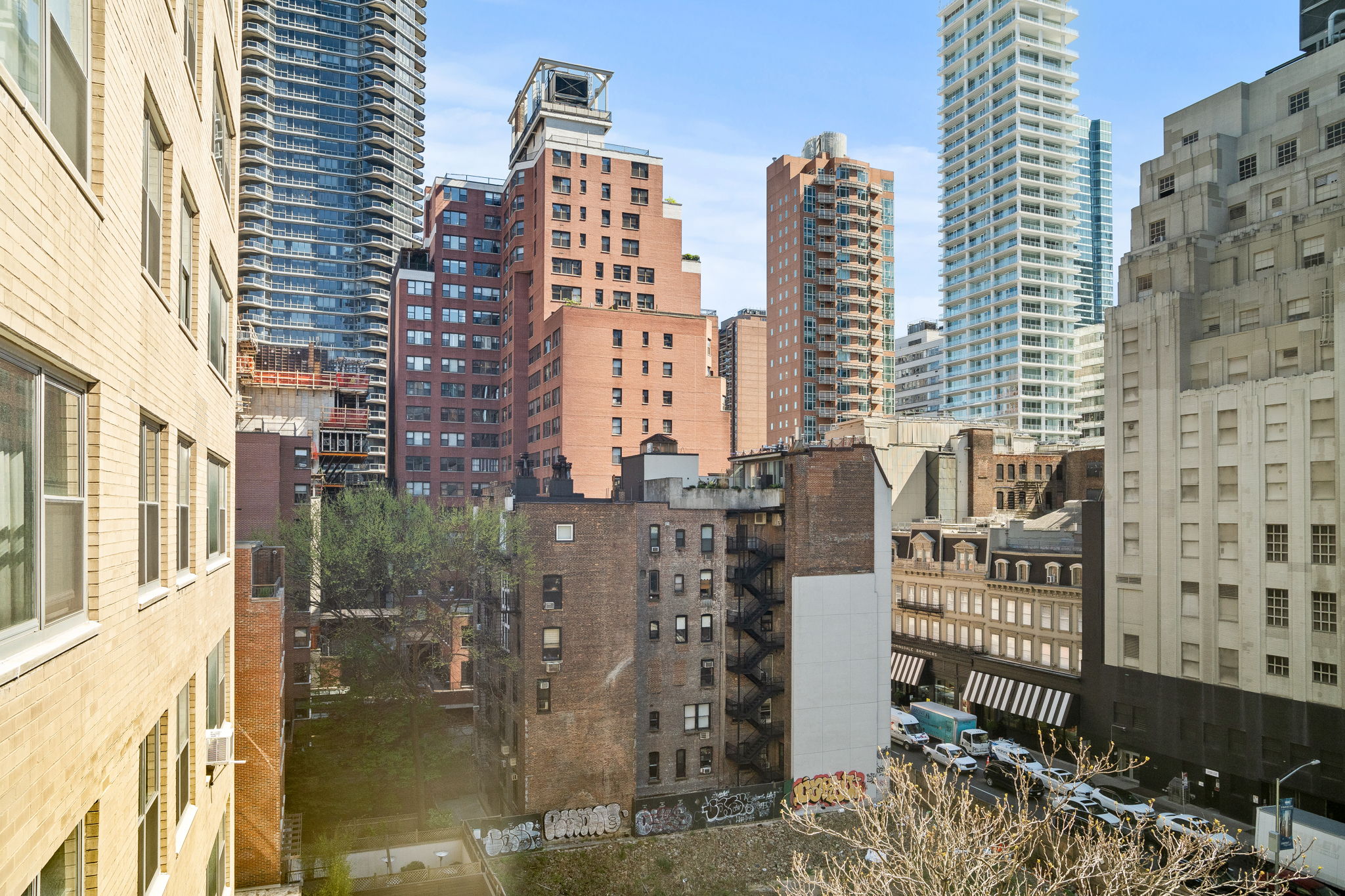 150 East 61st Street, Unit 8B Manhattan, NY 10065 - Photo 7 of 30 a city view with tall buildings