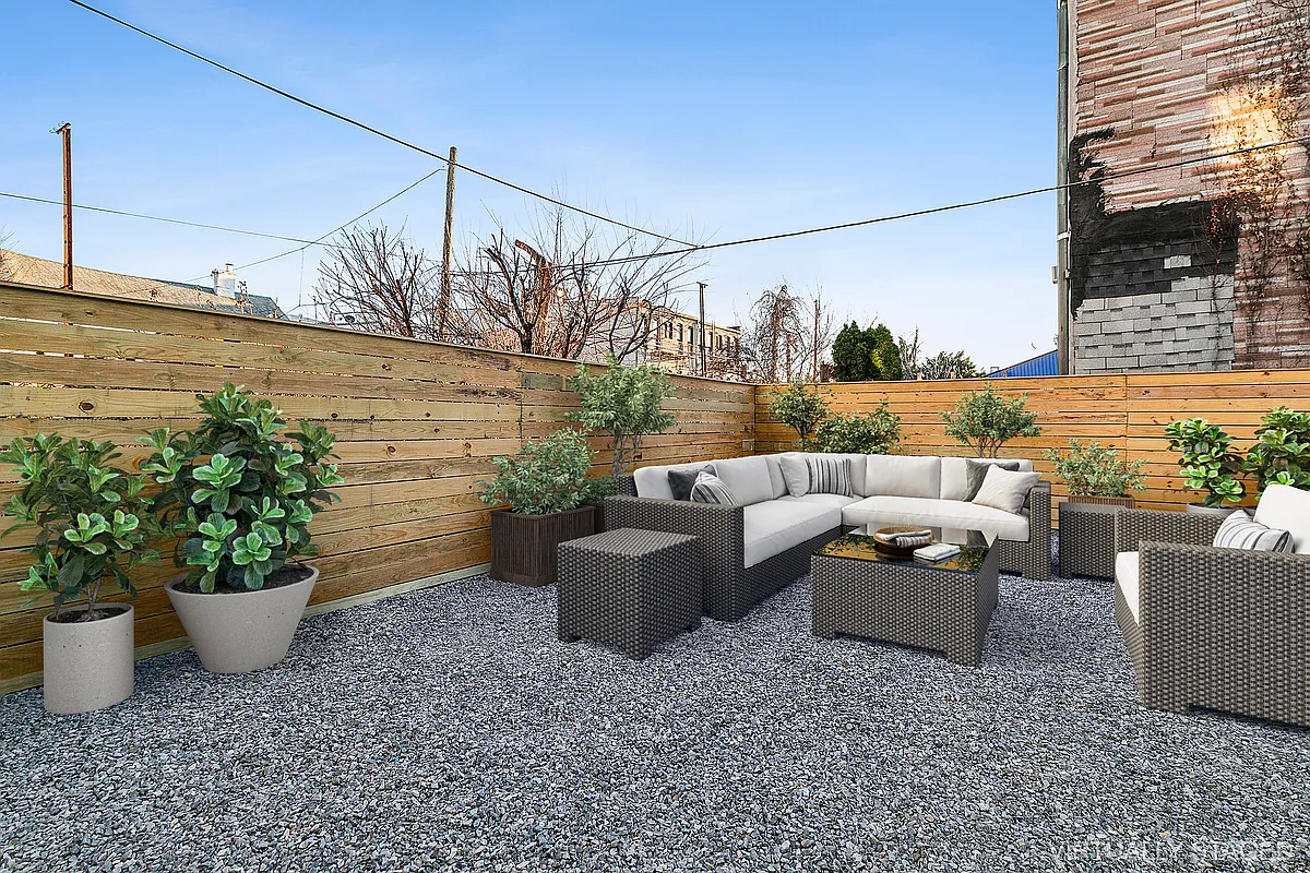 506 Woodward Avenue, Unit 1R Queens, NY 11385 - Photo 2 of 10 a view of a patio with couches and potted plants