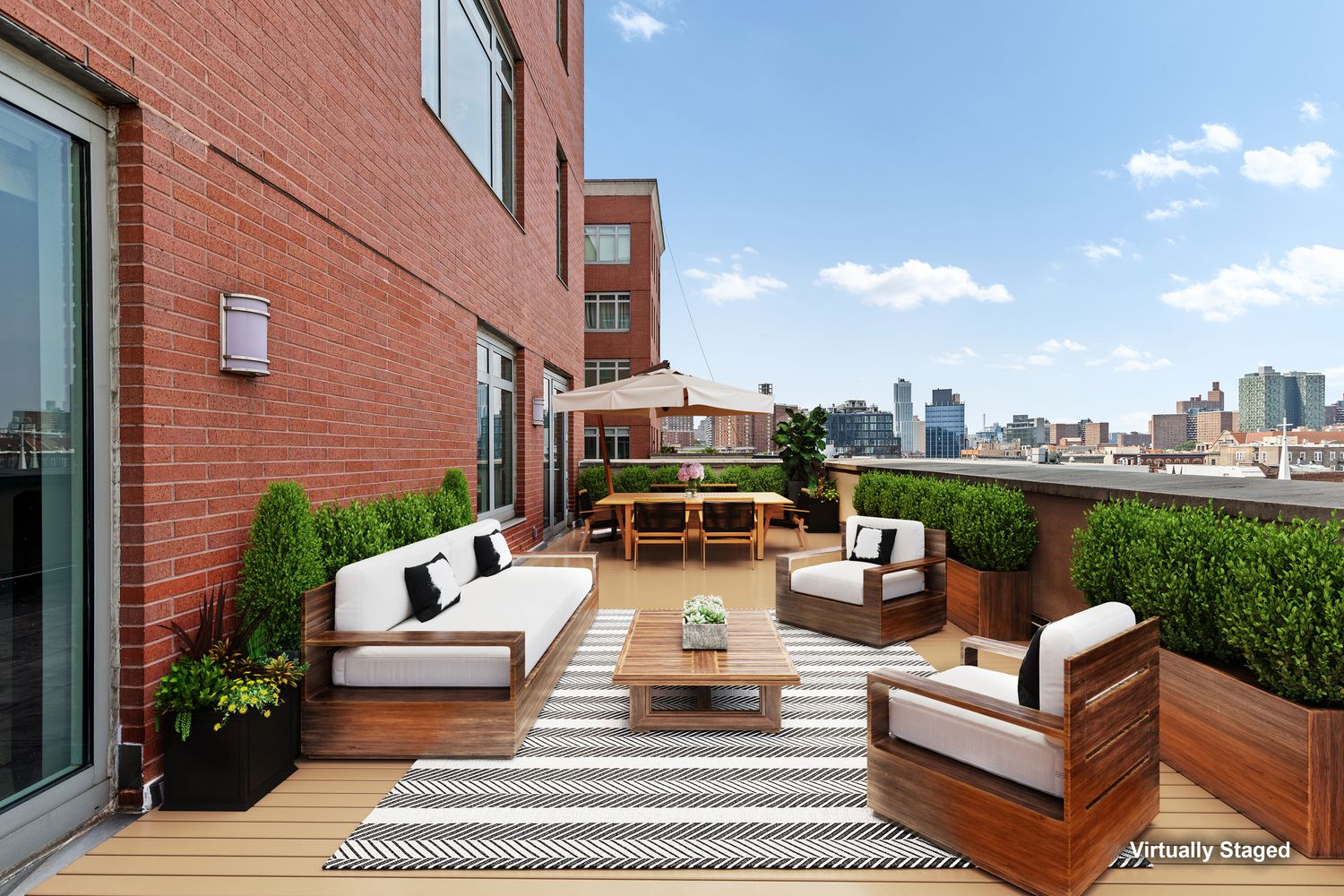 2300 Frederick Douglass Boulevard, Unit 9F Manhattan, NY 10027 - Photo 3 of 15 a view of a patio with couches and a table and chairs