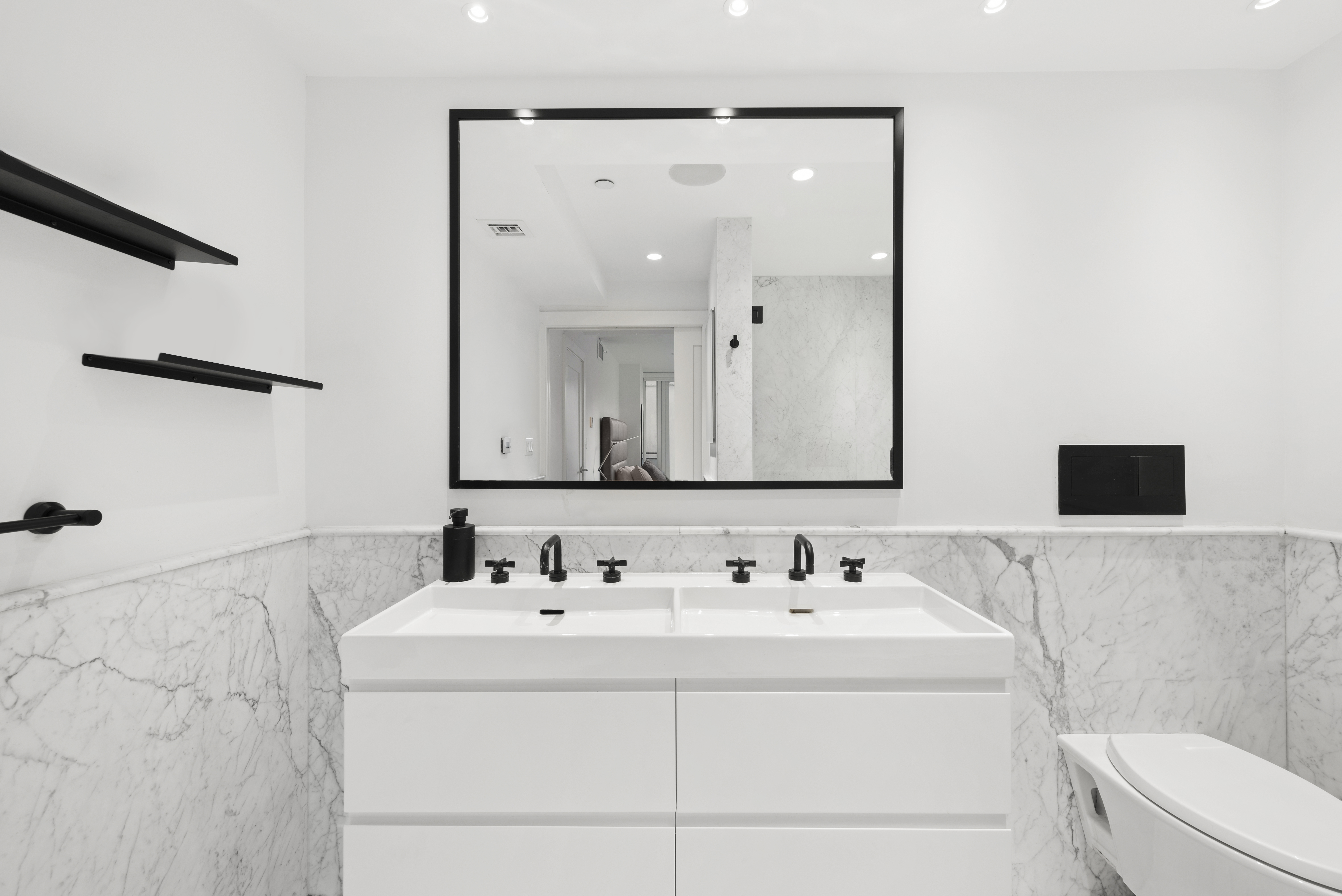 265 East Houston Street, Unit 4 Manhattan, NY 10002 - Photo 10 of 20 a bathroom with a sink and a mirror