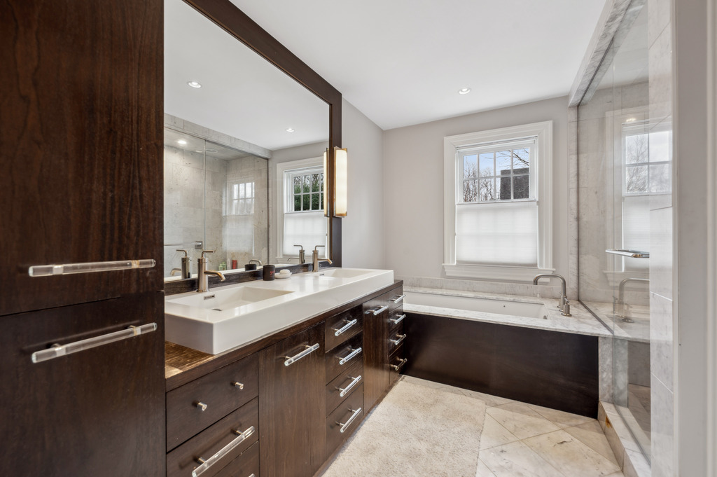 79 Pine Street Dover, MA 02030 - Photo 21 of 25 a spacious bathroom with a double vanity sink a mirror and a bathtub