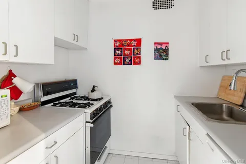 a kitchen with a white refrigerator and a stove