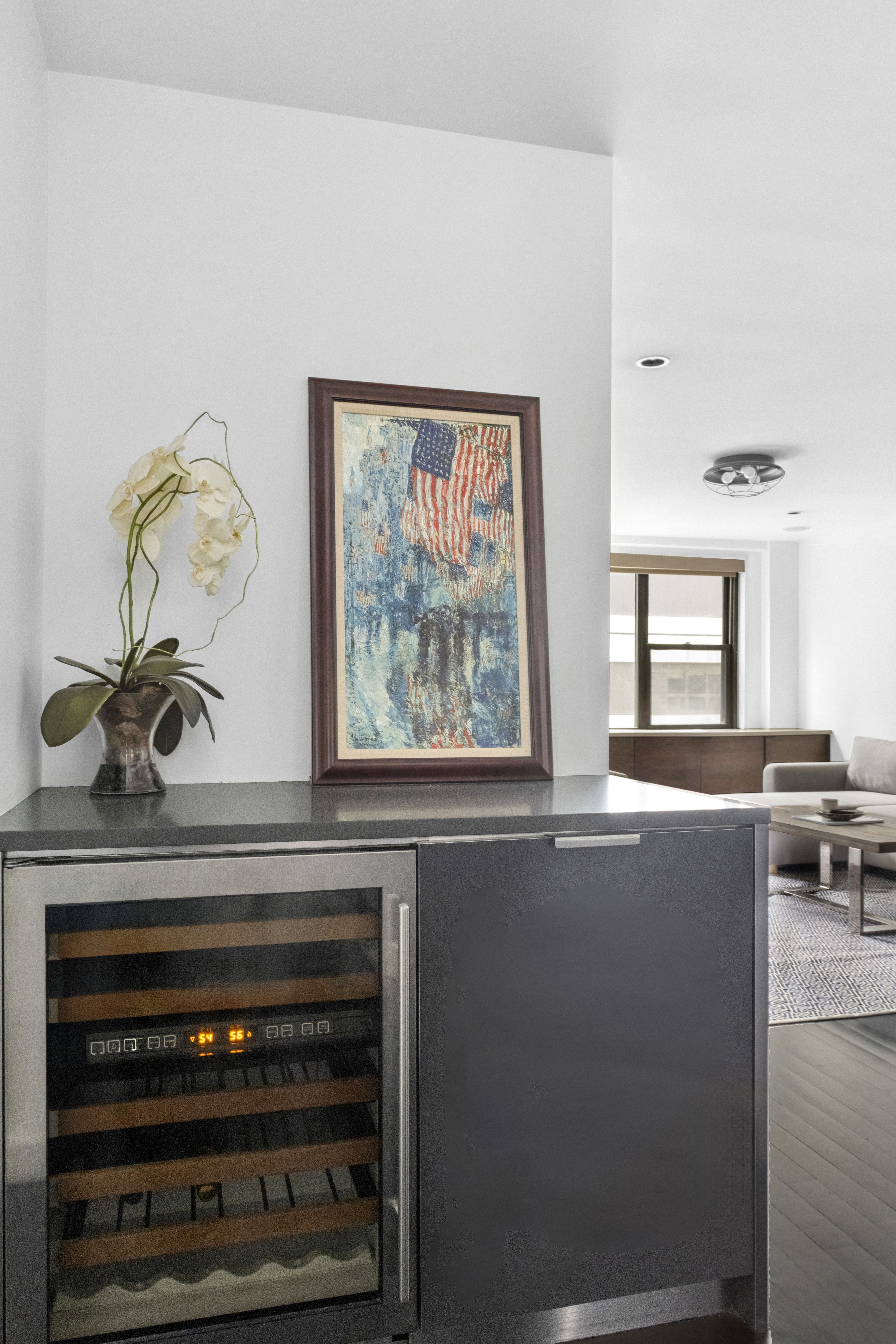 235 East 57th Street, Unit 5D Manhattan, NY 10022 - Photo 5 of 10 a living room with furniture stove and window