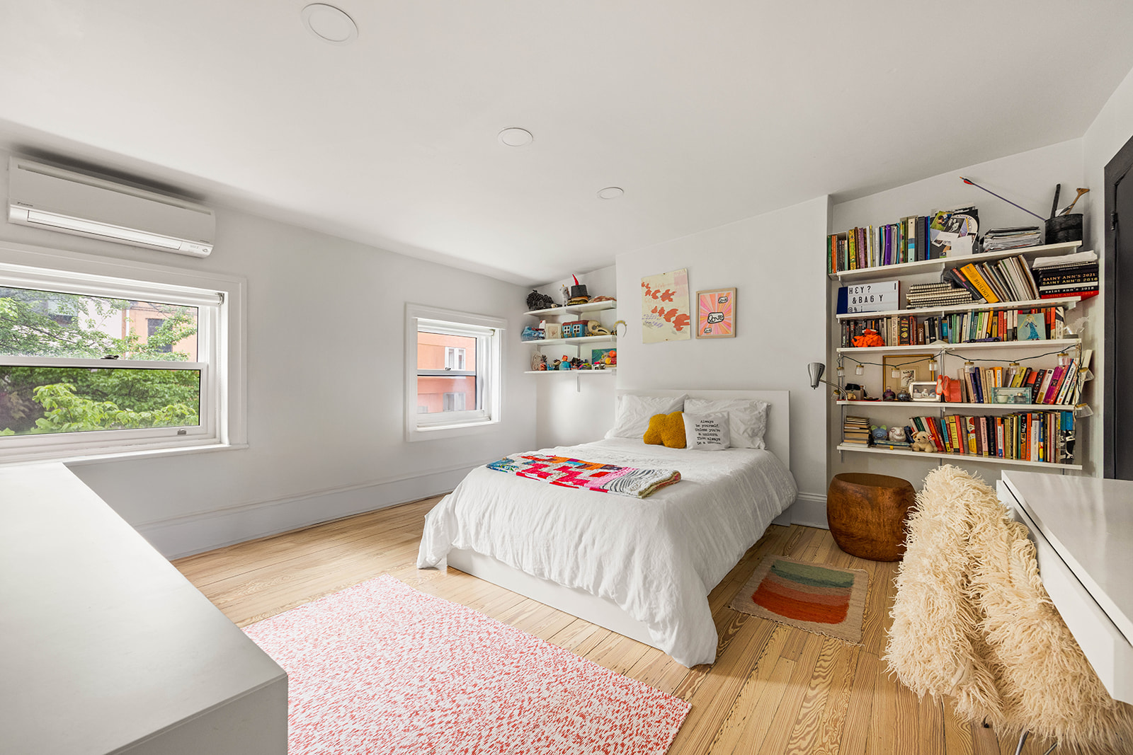 298 State Street, Unit TRIPLEX Brooklyn, NY 11201 - Photo 14 of 21 a bed room with a bed and a book shelf