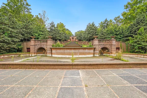 a view of a building with sitting area