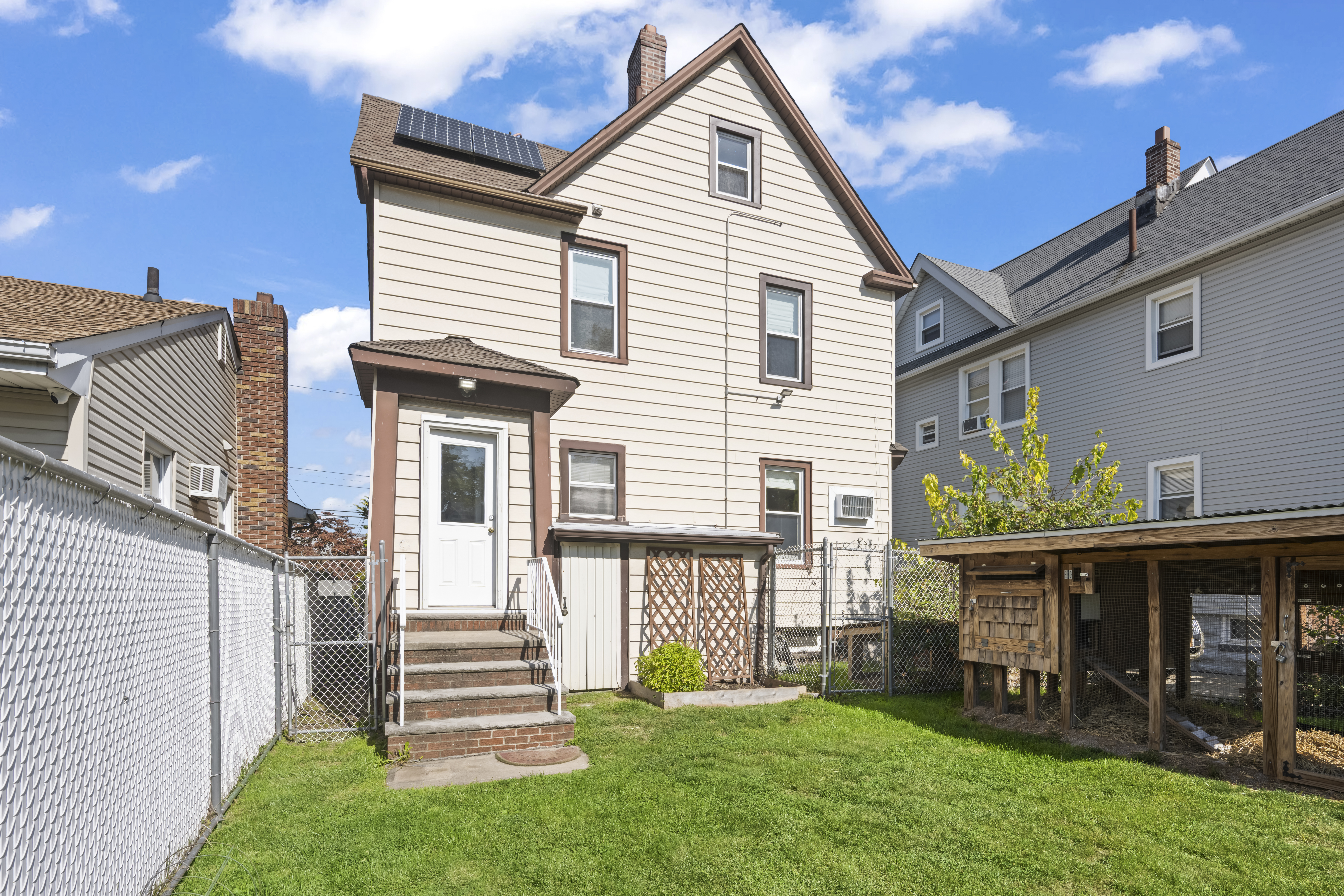 704 Delafield Avenue Staten Island, NY 10310 - Photo 30 of 35 a view of a house with backyard and porch