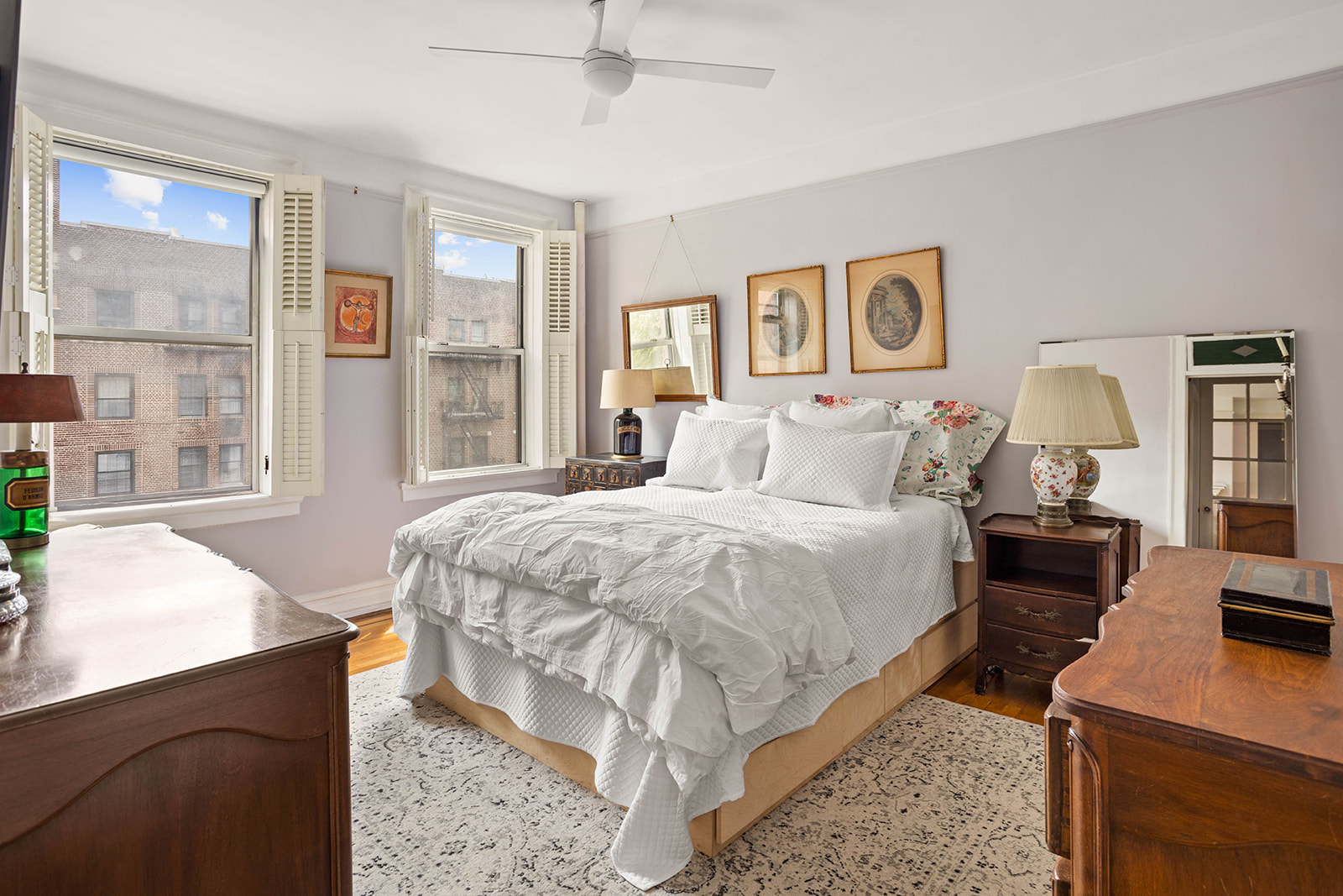 37-28 80th Street, Unit 32 Queens, NY 11372 - Photo 5 of 13 a bedroom with a bed and wooden floor