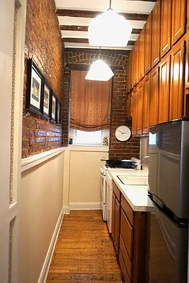 30 East 95th Street, Unit 2E Manhattan, NY 10128 - Photo 3 of 6 a utility room with a sink a washer and dryer
