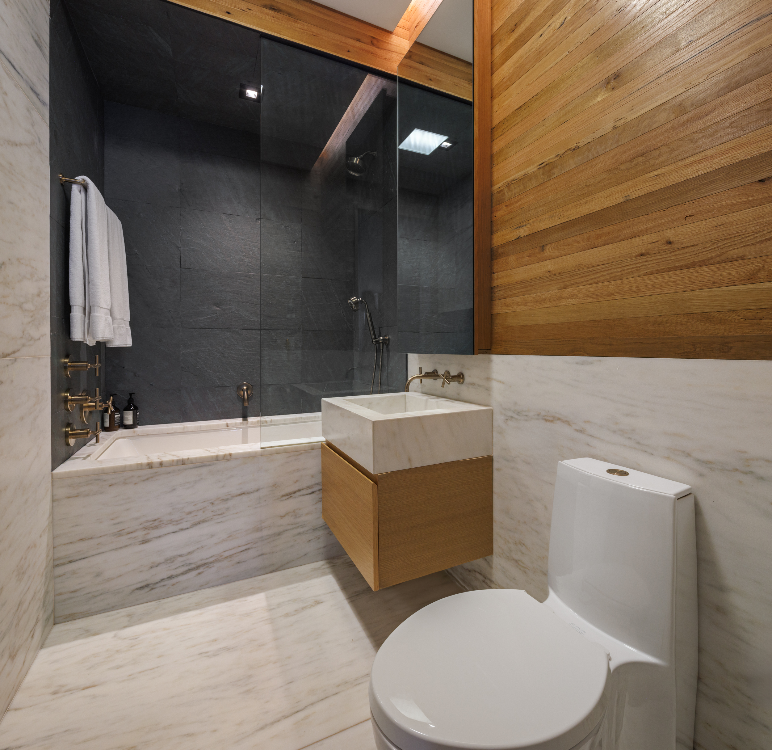 60 White Street, Unit 4E Manhattan, NY 10013 - Photo 16 of 19 a bathroom with a sink mirror vanity and toilet