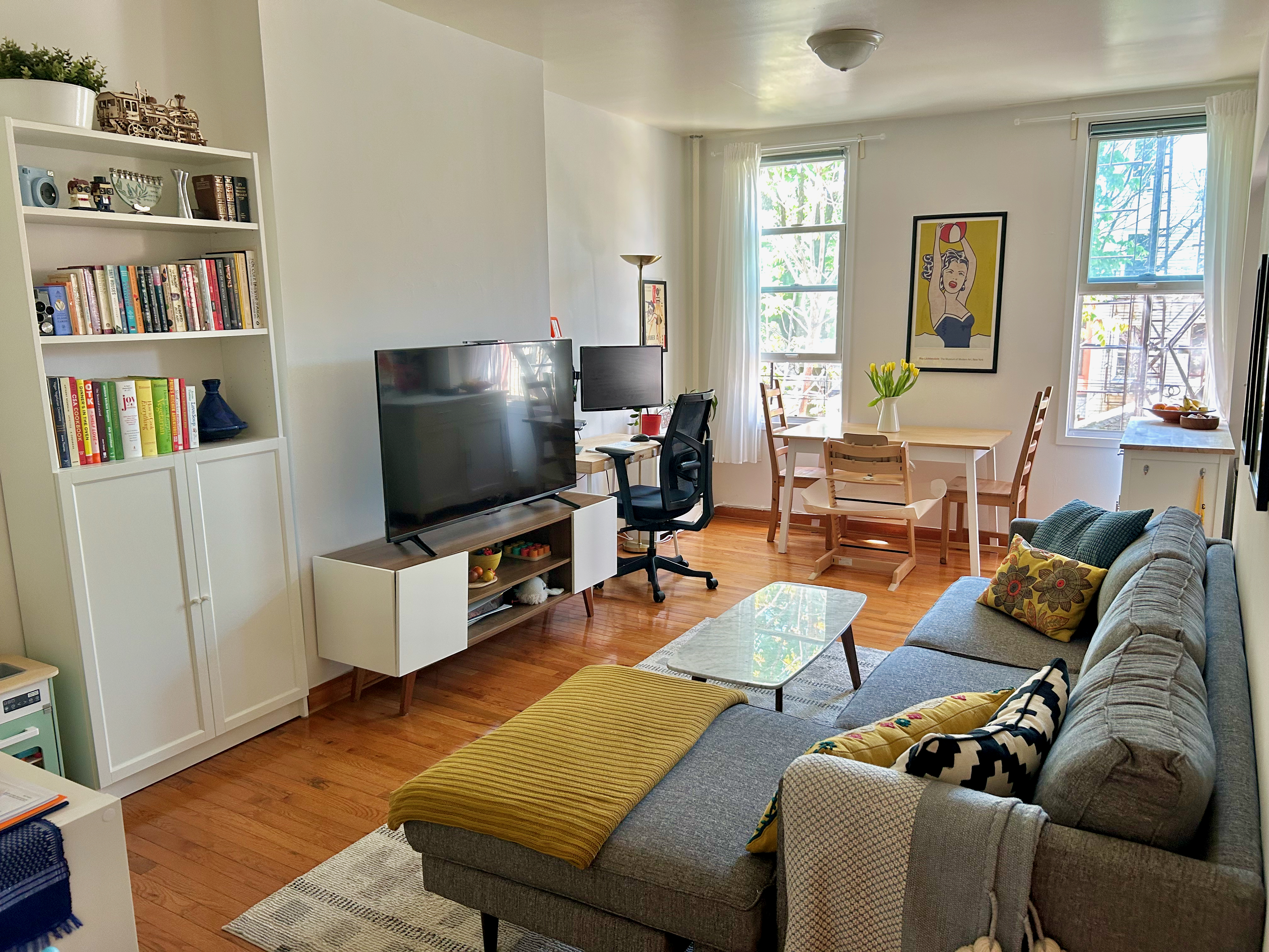 250 19th Street, Unit 2 Brooklyn, NY 11215 - Photo 2 of 18 a living room with furniture and a flat screen tv