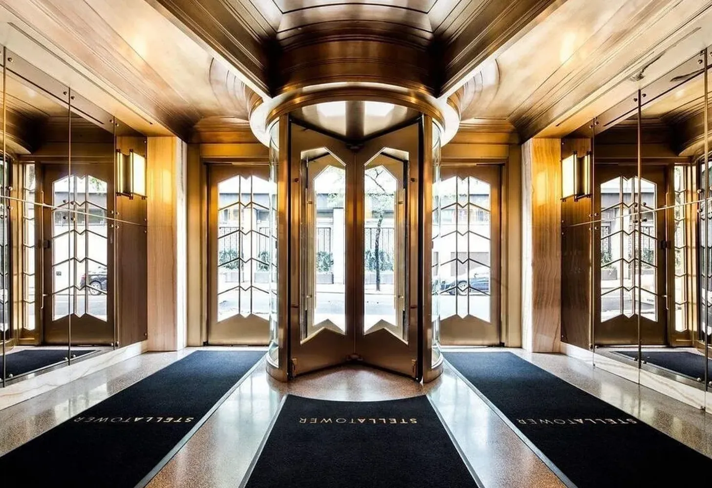 a large room with a large bed and large windows