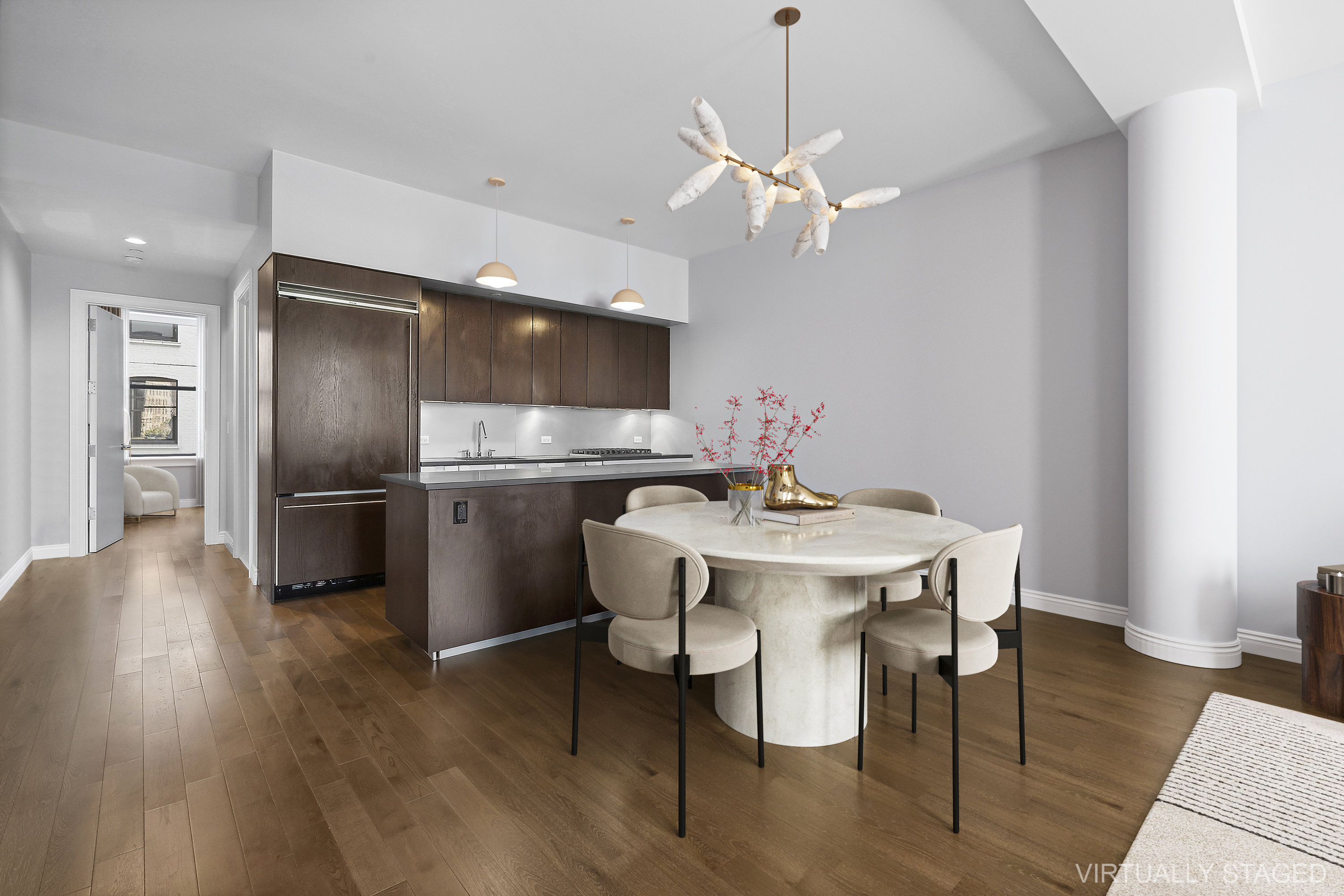 225 5th Avenue, Unit 7K Manhattan, NY 10010 - Photo 3 of 14 a kitchen with stainless steel appliances a dining table chairs and wooden floor