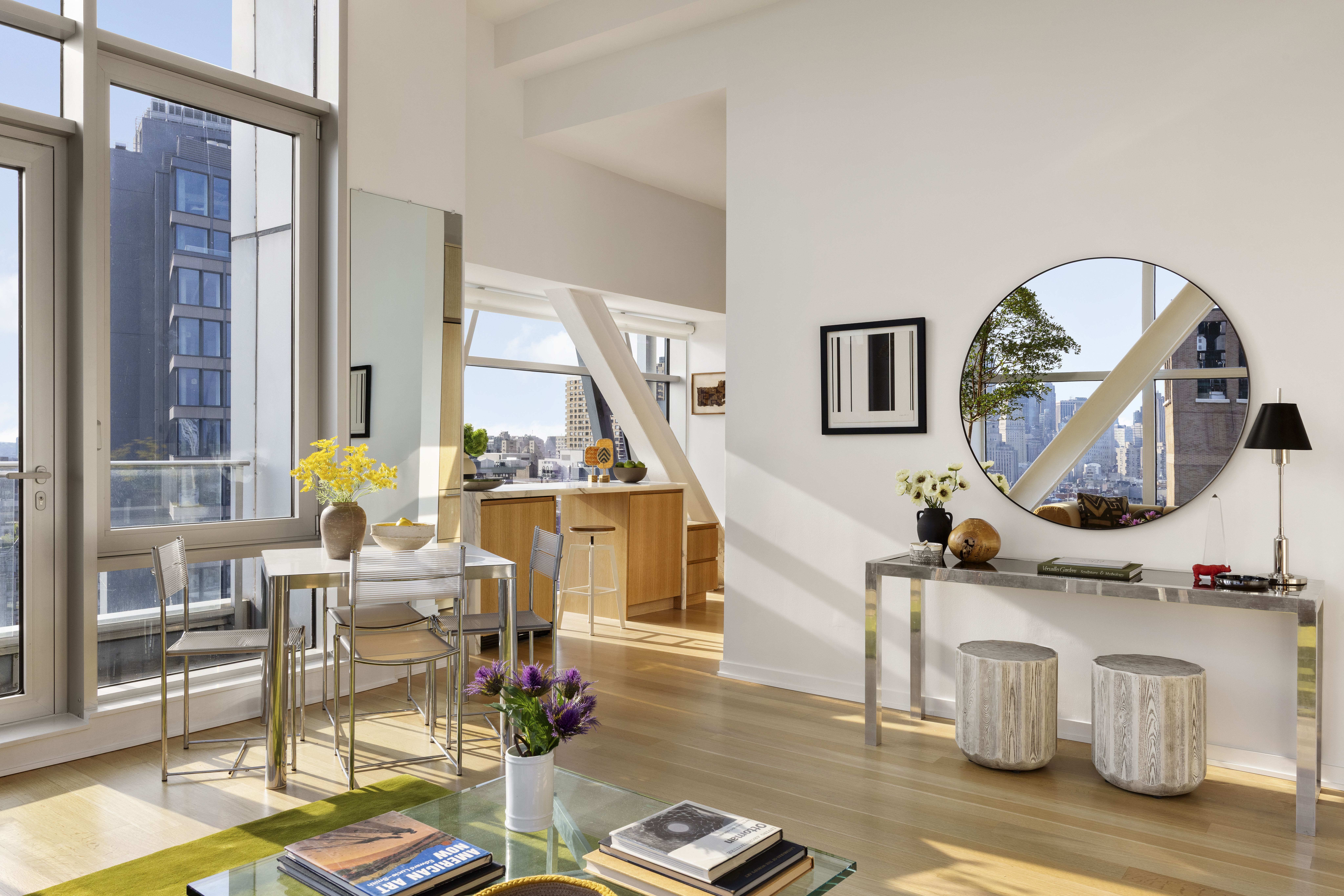 52 East 4th Street, Unit PH3 Manhattan, NY 10003 - Photo 6 of 22 a living room with furniture and a mirror