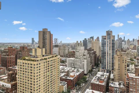 a view of a city with tall buildings